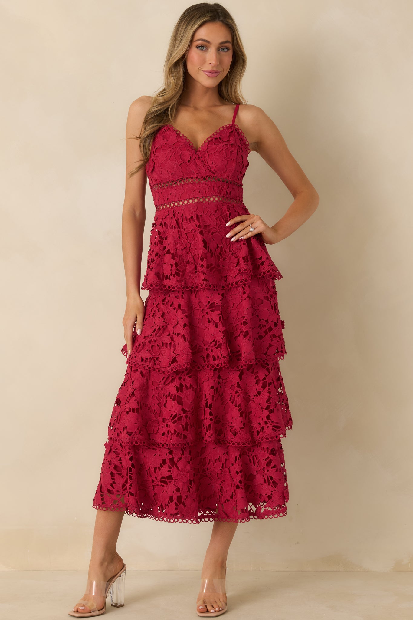 Red maxi dress with V-neckline, adjustable spaghetti straps, and tiered floral lace overlay.