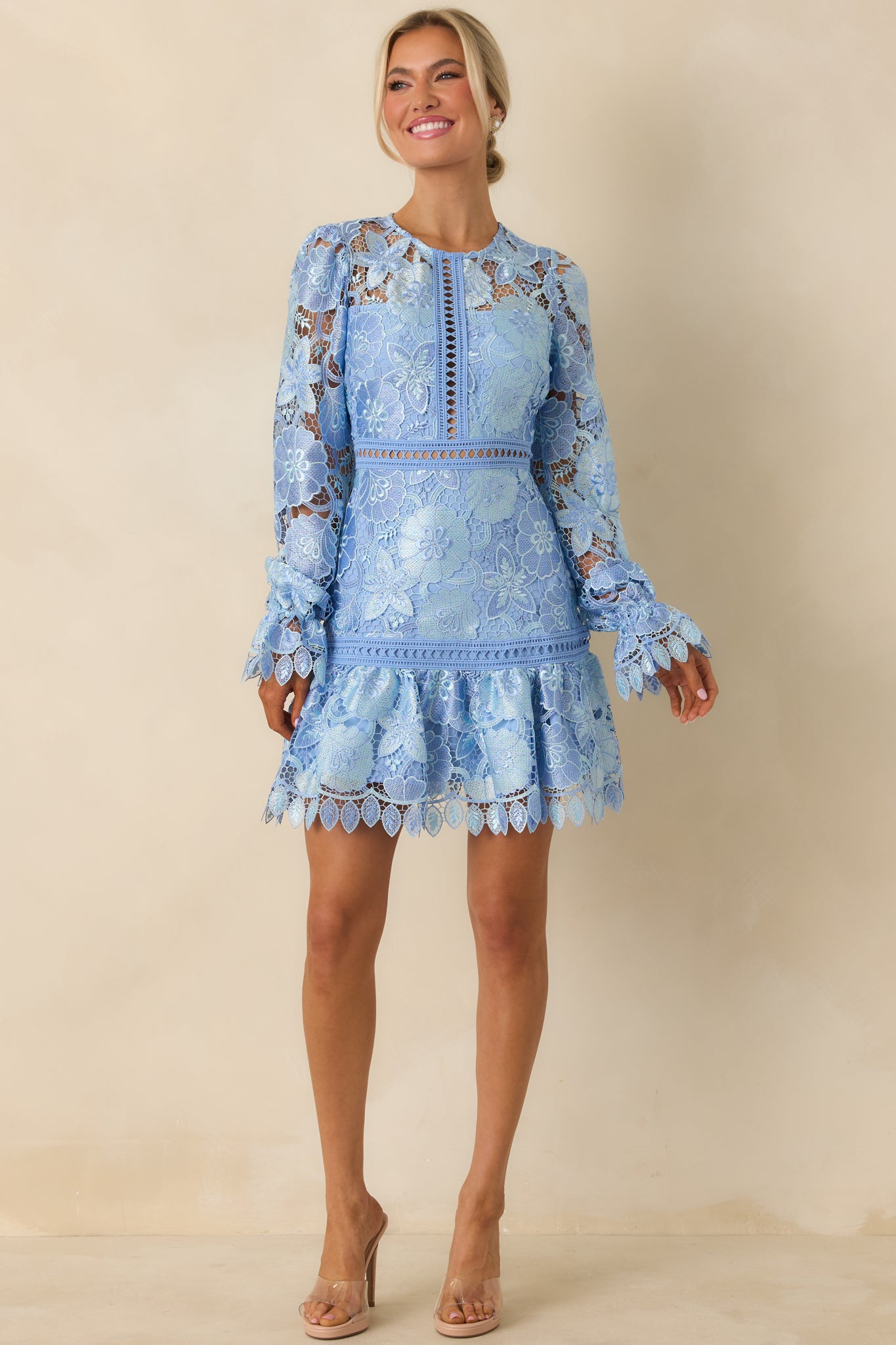 Front-facing mini dress showing crew neckline, single tier design, and delicate transparent accents.