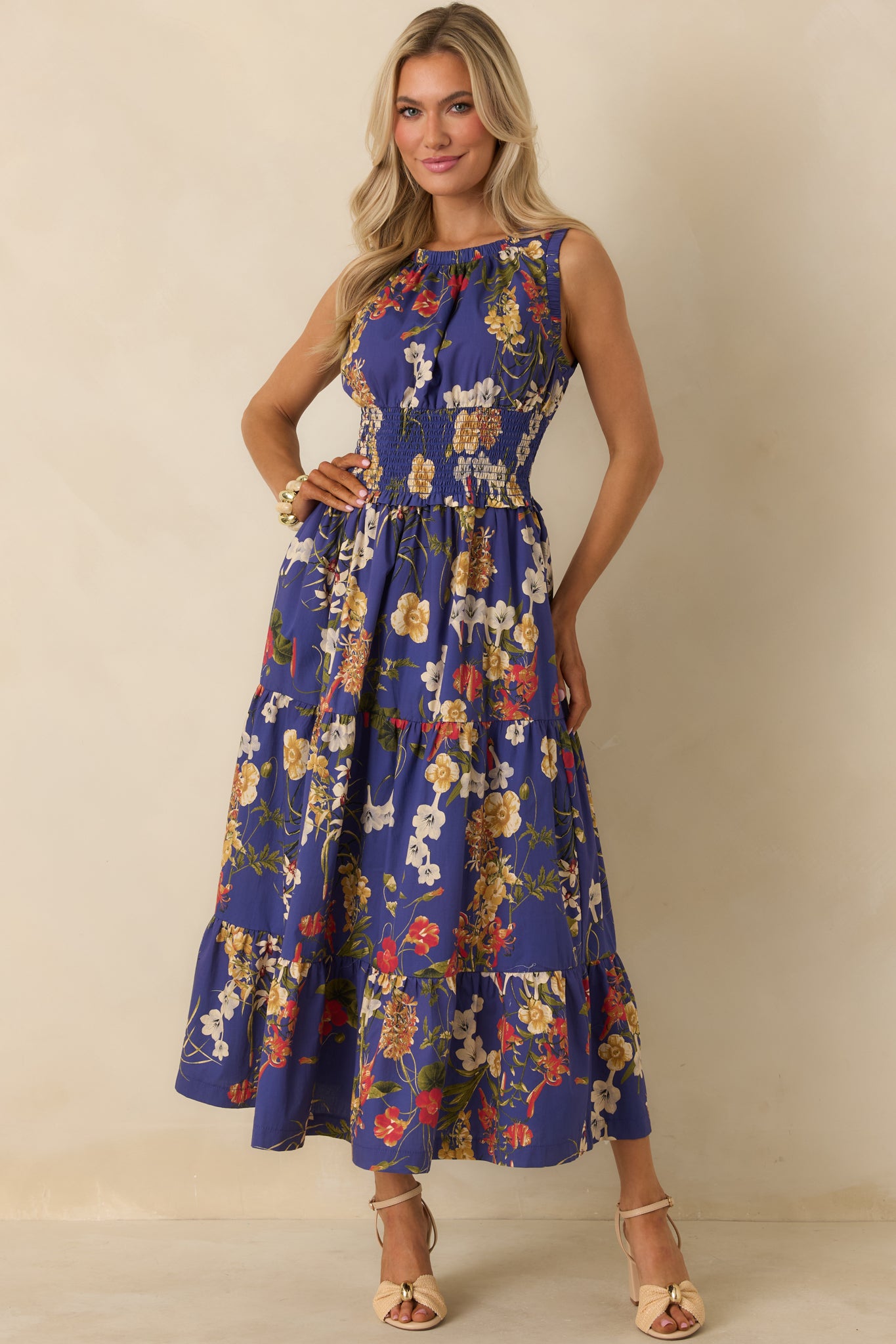 Front view of cobalt blue floral maxi dress featuring smocked waistband, soft-tiered skirt, and lightweight cotton fabric.
