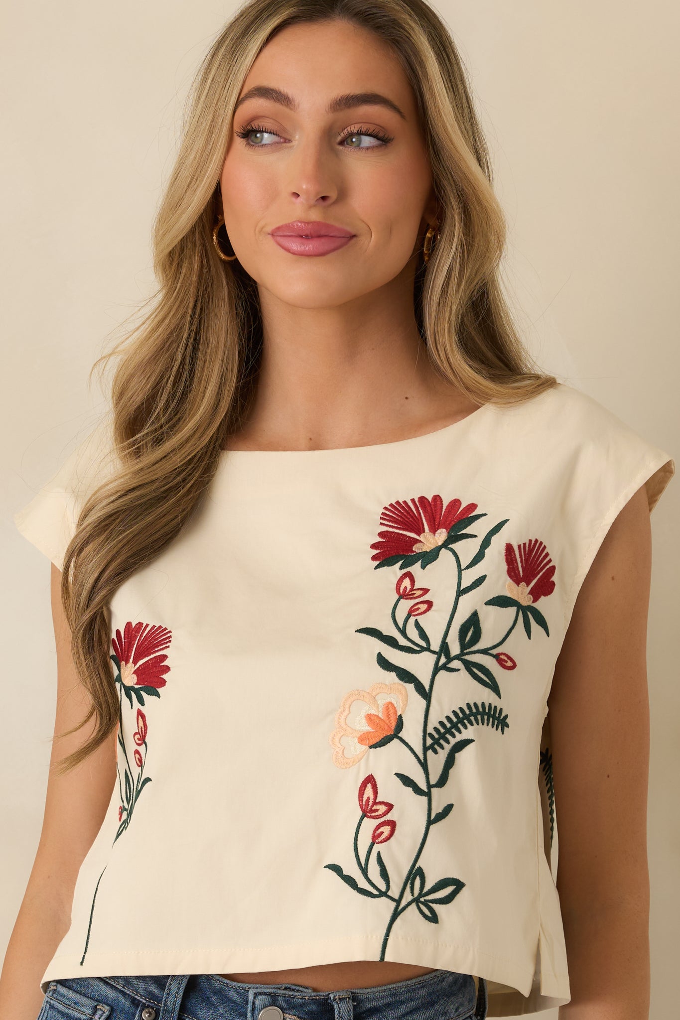 Closer view showing the cap sleeve shape and polished straight hemline.