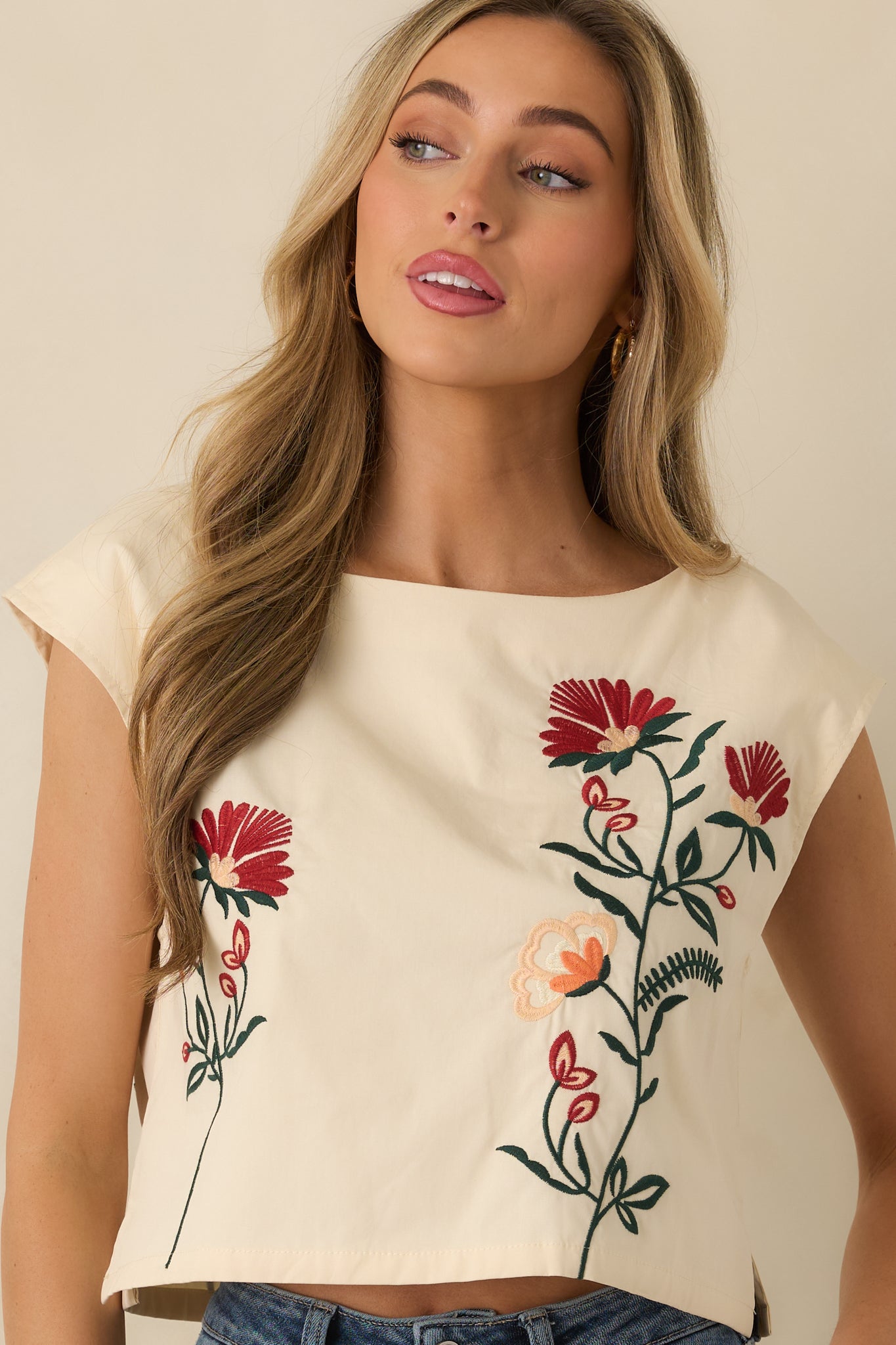 Closer view of the front embroidery and smooth lining of the top for comfortable coverage.
