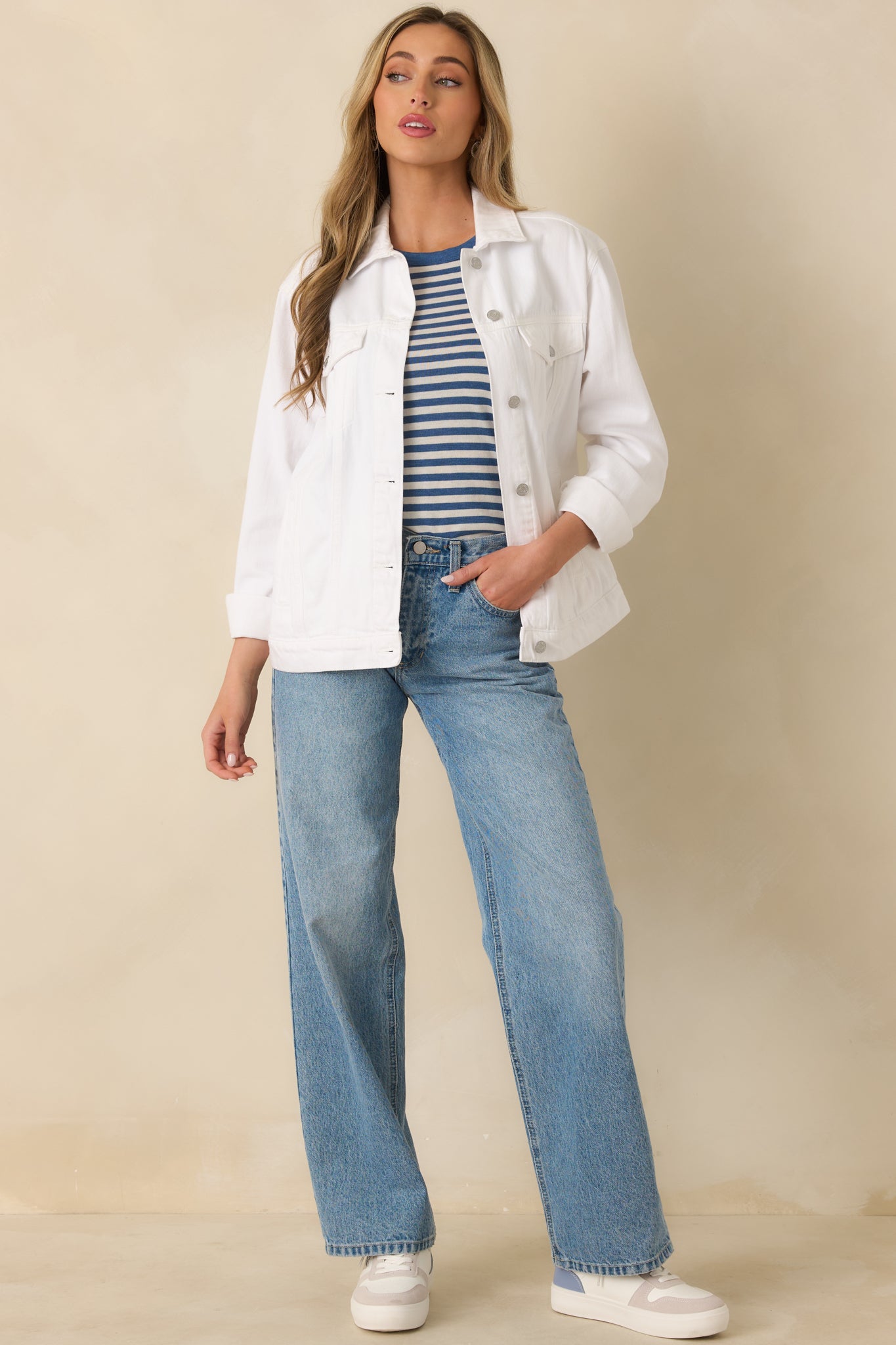 Straight-on front angle showing the structured fit, chest pockets, and full button closure of the jacket.