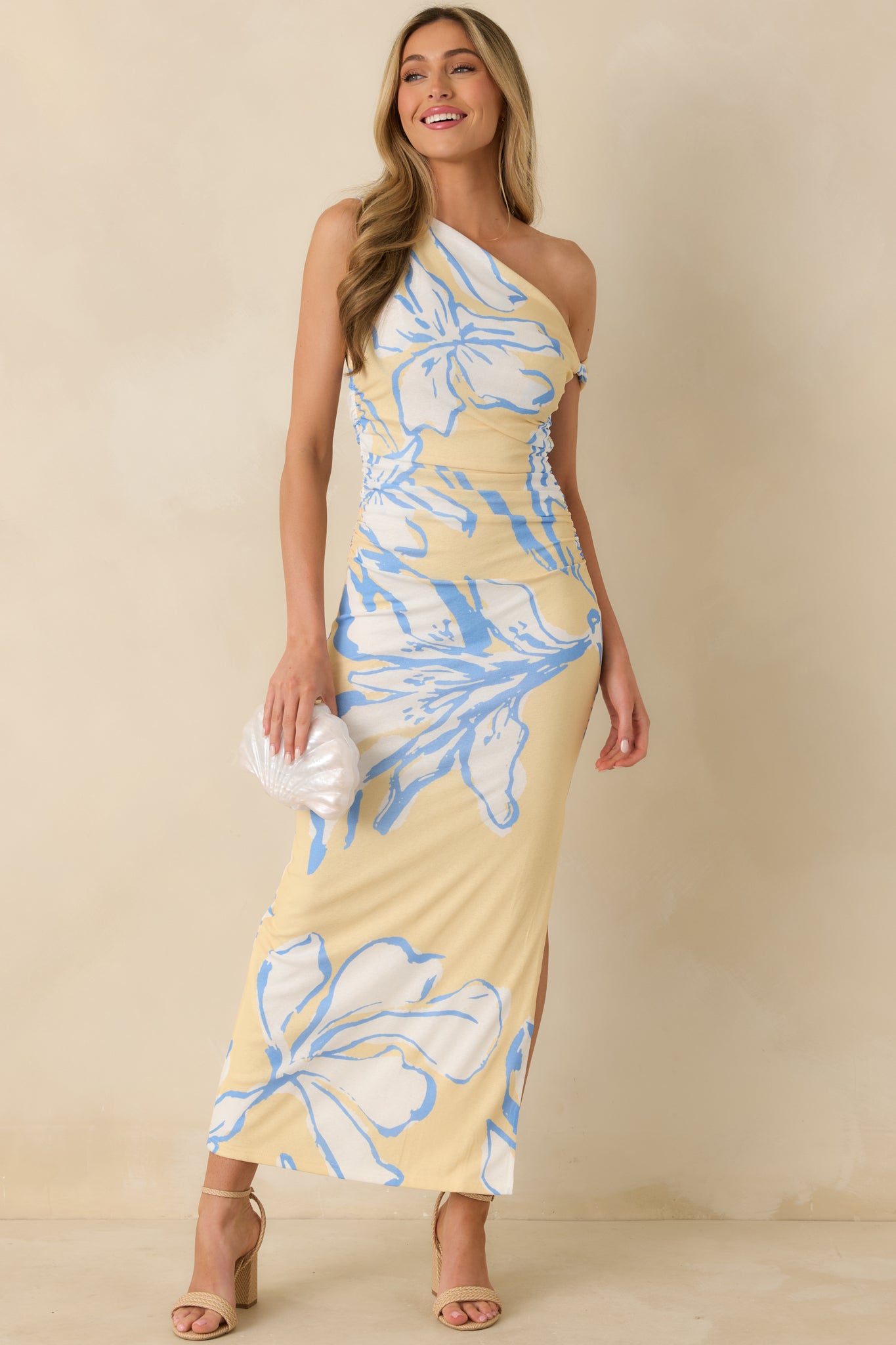 Floral mesh maxi dress designed with ruched side detailing, lightweight semi-sheer fabric, and a soft flowy drape.