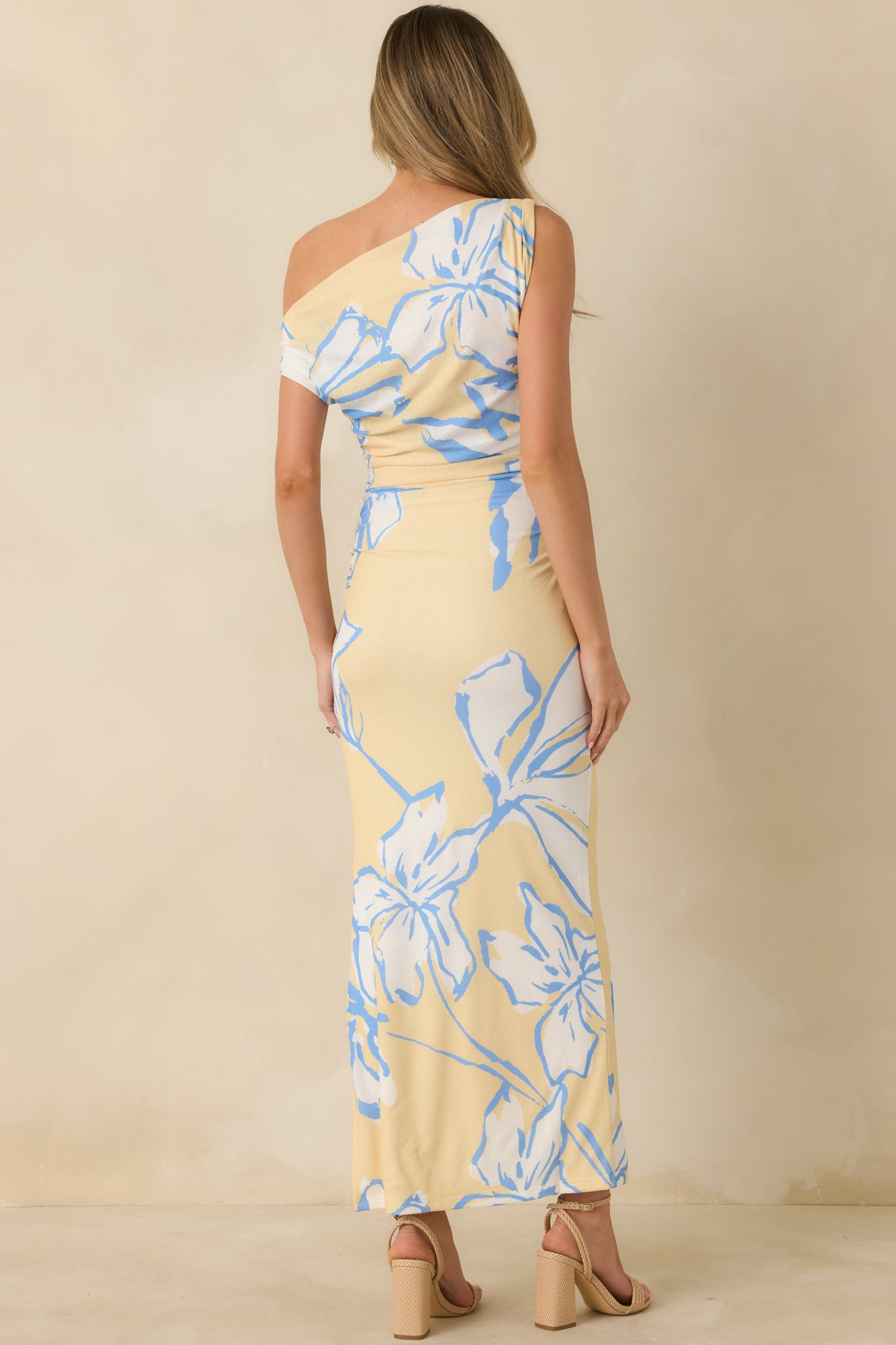 Rear view of the floral mesh maxi dress showing the smooth lined finish, continuous floral pattern, and flowing maxi-length silhouette.