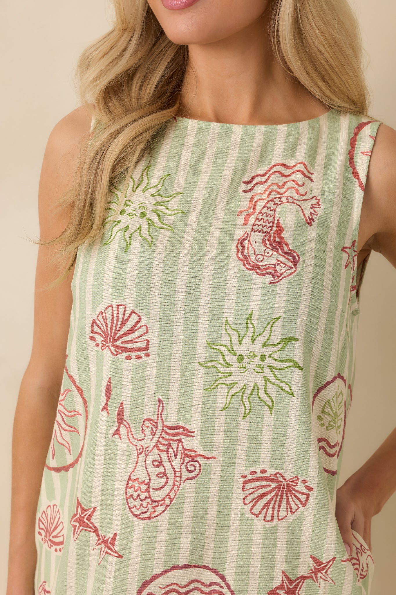 Detailed close-up of the pink mermaid print and smooth linen-blend texture.