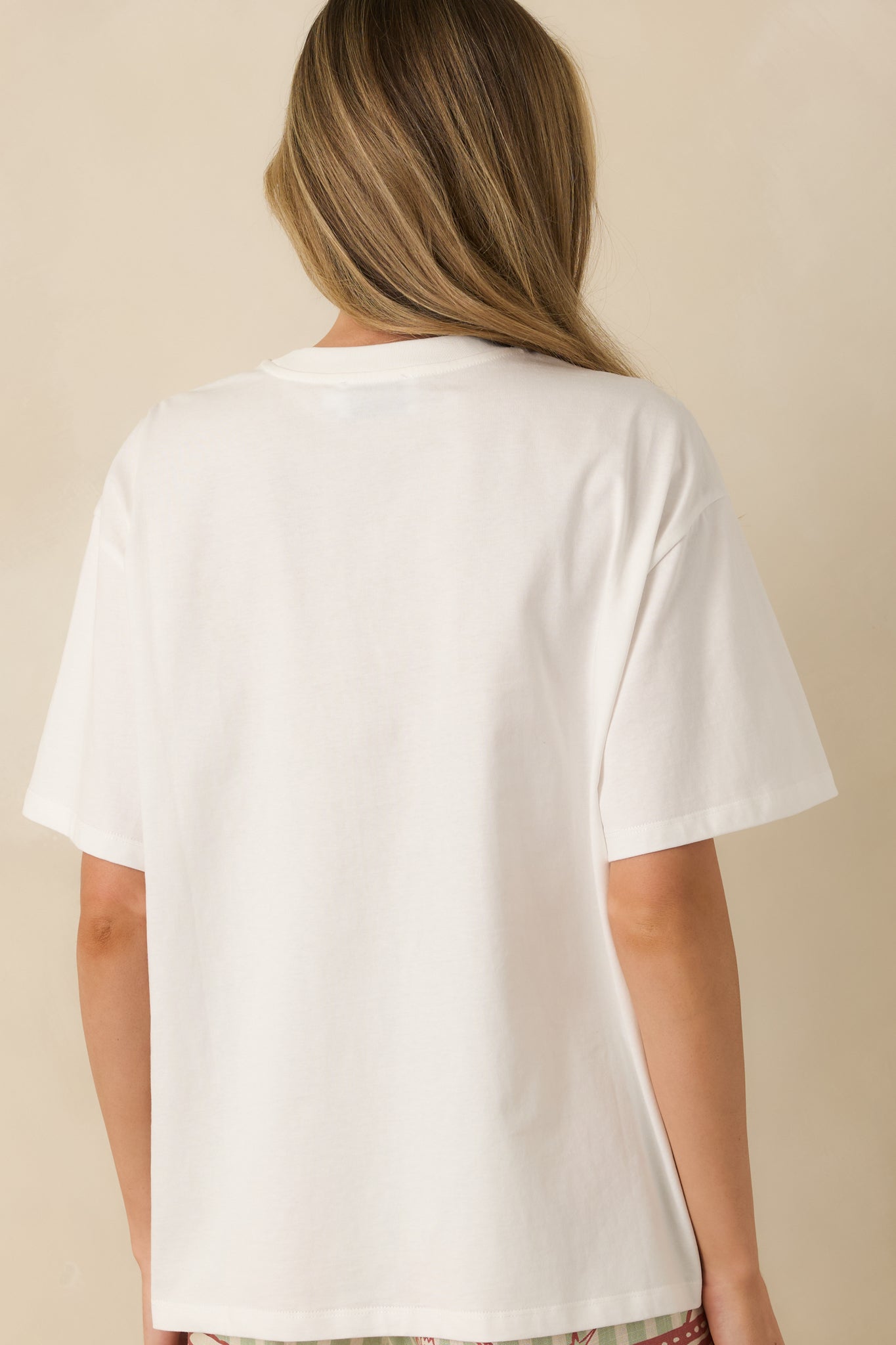 Back view of the short sleeve T-shirt displaying the relaxed silhouette and clean back design.