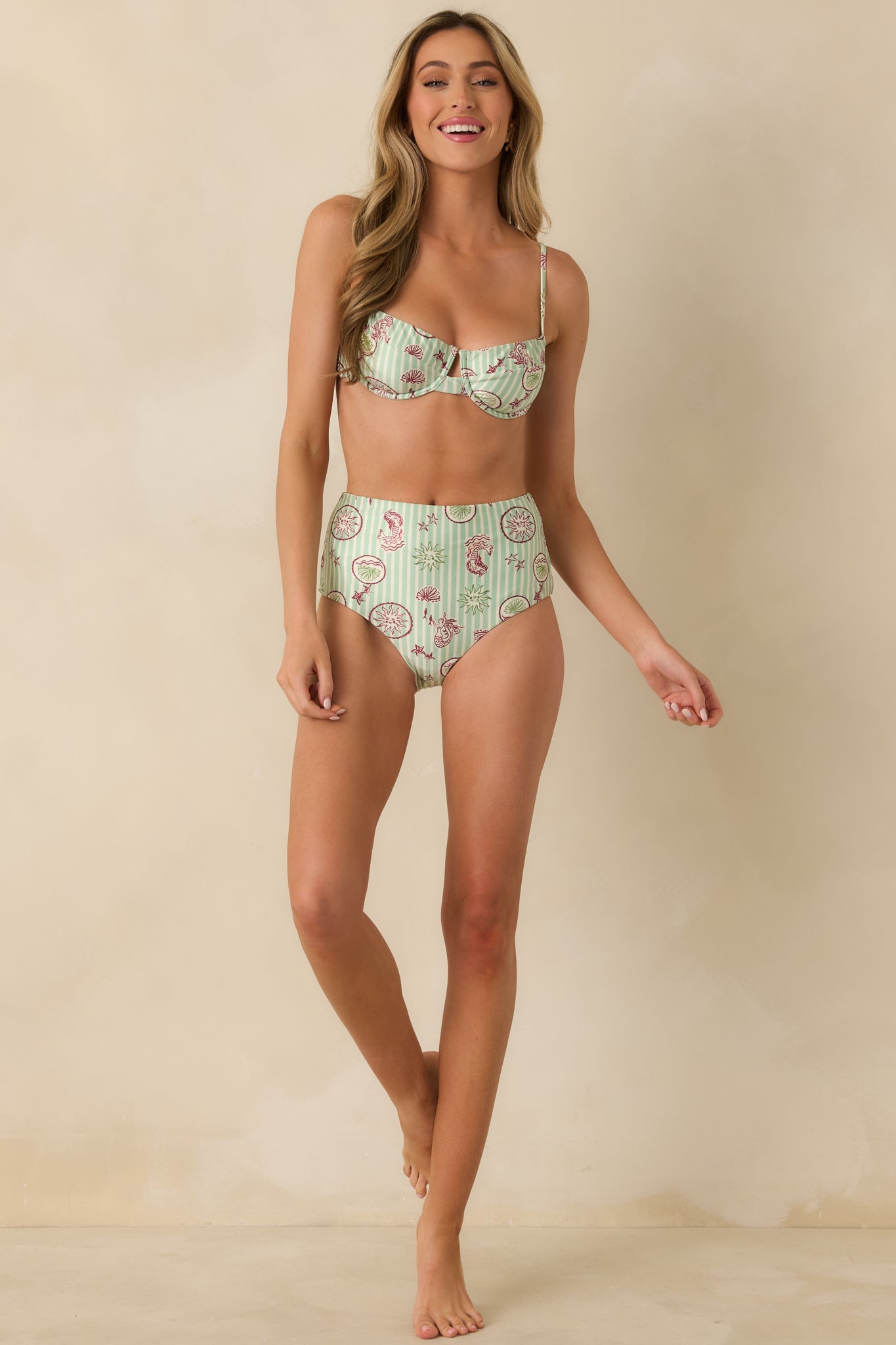 Green and white striped bikini top with defined underwire shaping and a flattering, structured silhouette.