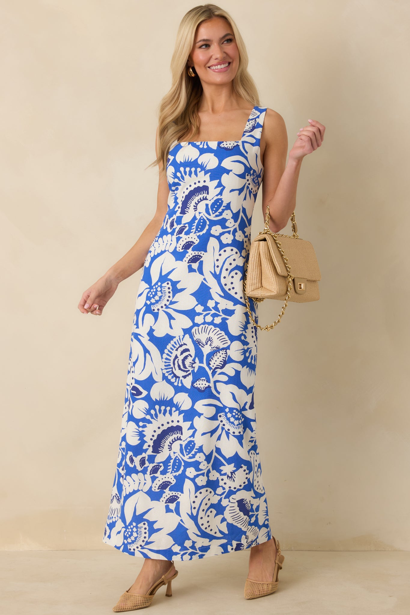 Linen-blend sleeveless maxi dress featuring a structured bodice, breathable fabric, and lightweight drape through the length.