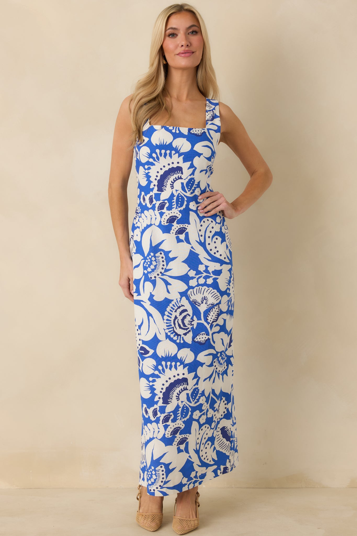 Relaxed-flowing linen-blend maxi dress with sleeveless design, smooth inner lining, and structured front bodice.
