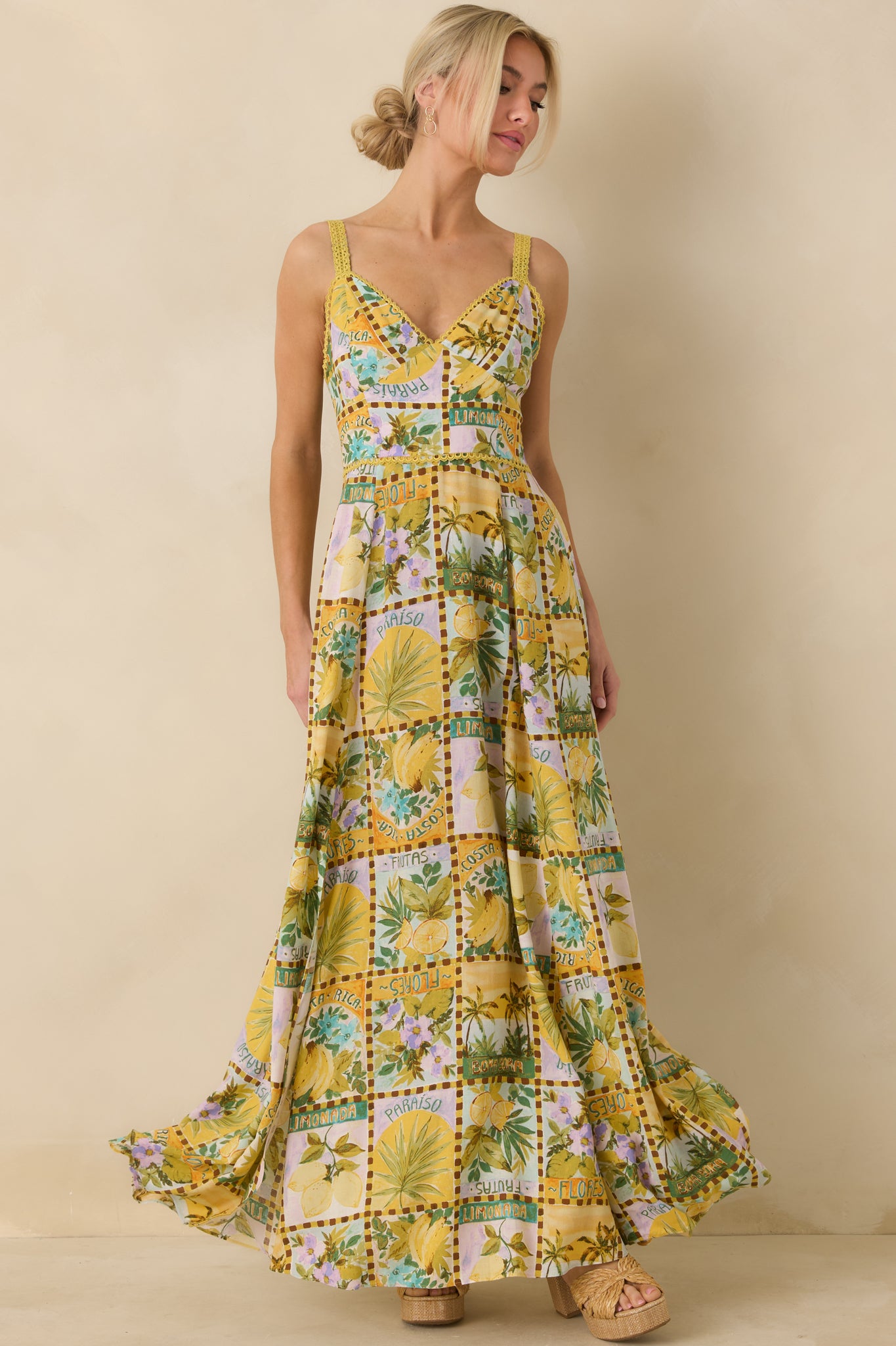Yellow maxi dress with multicolor tropical print and flattering V-neckline.