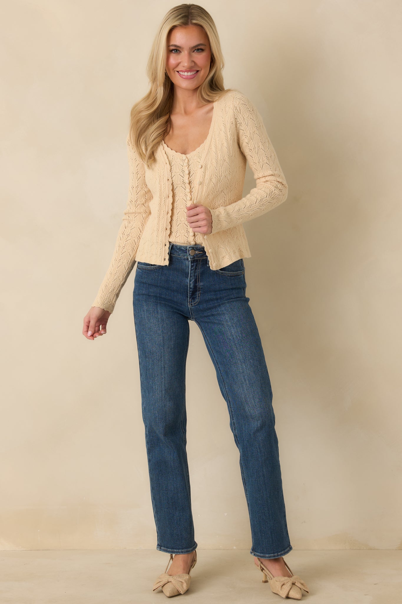 Full front view emphasizing the functional button-front closure and relaxed fit.