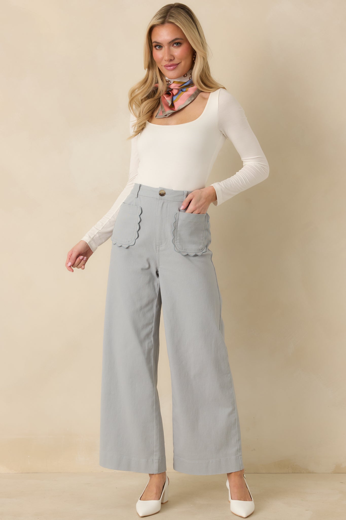 Wide leg dusty blue pants in breathable woven fabric with structured fit.