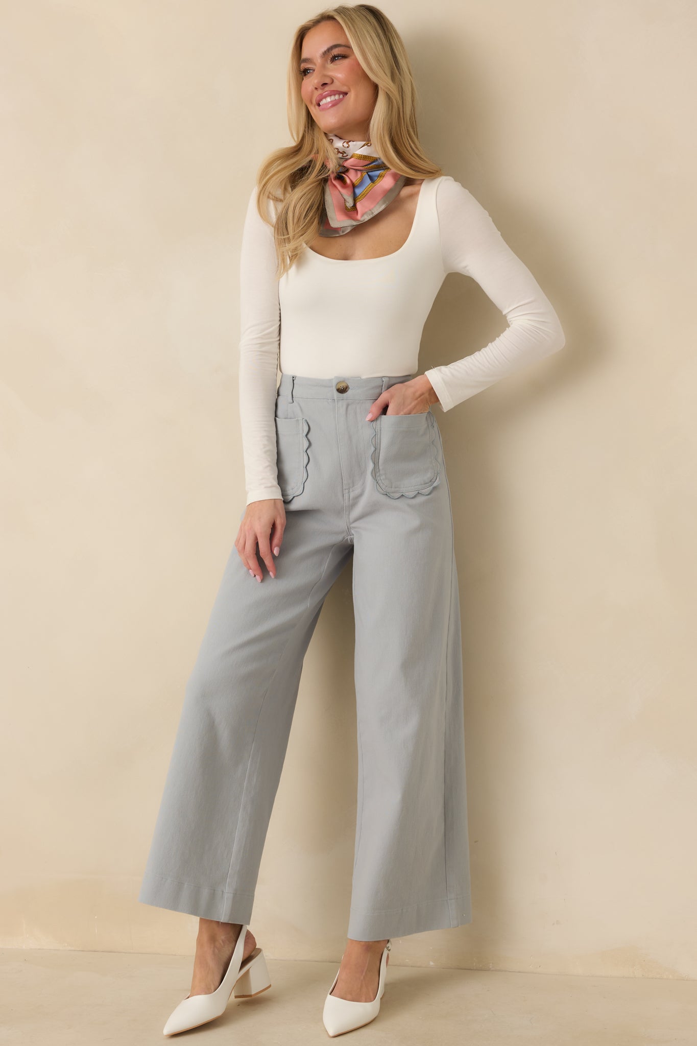 Dusty blue cotton pants with high-rise waist, wide legs, and clean silhouette.