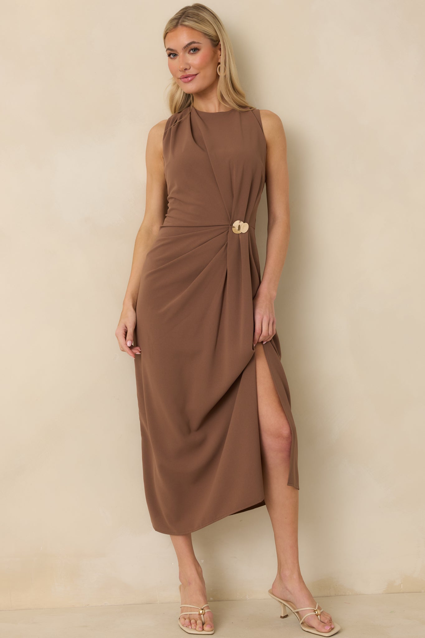 Light brown dress with smooth silhouette, round neck, and centered ruched detail with metallic accent.