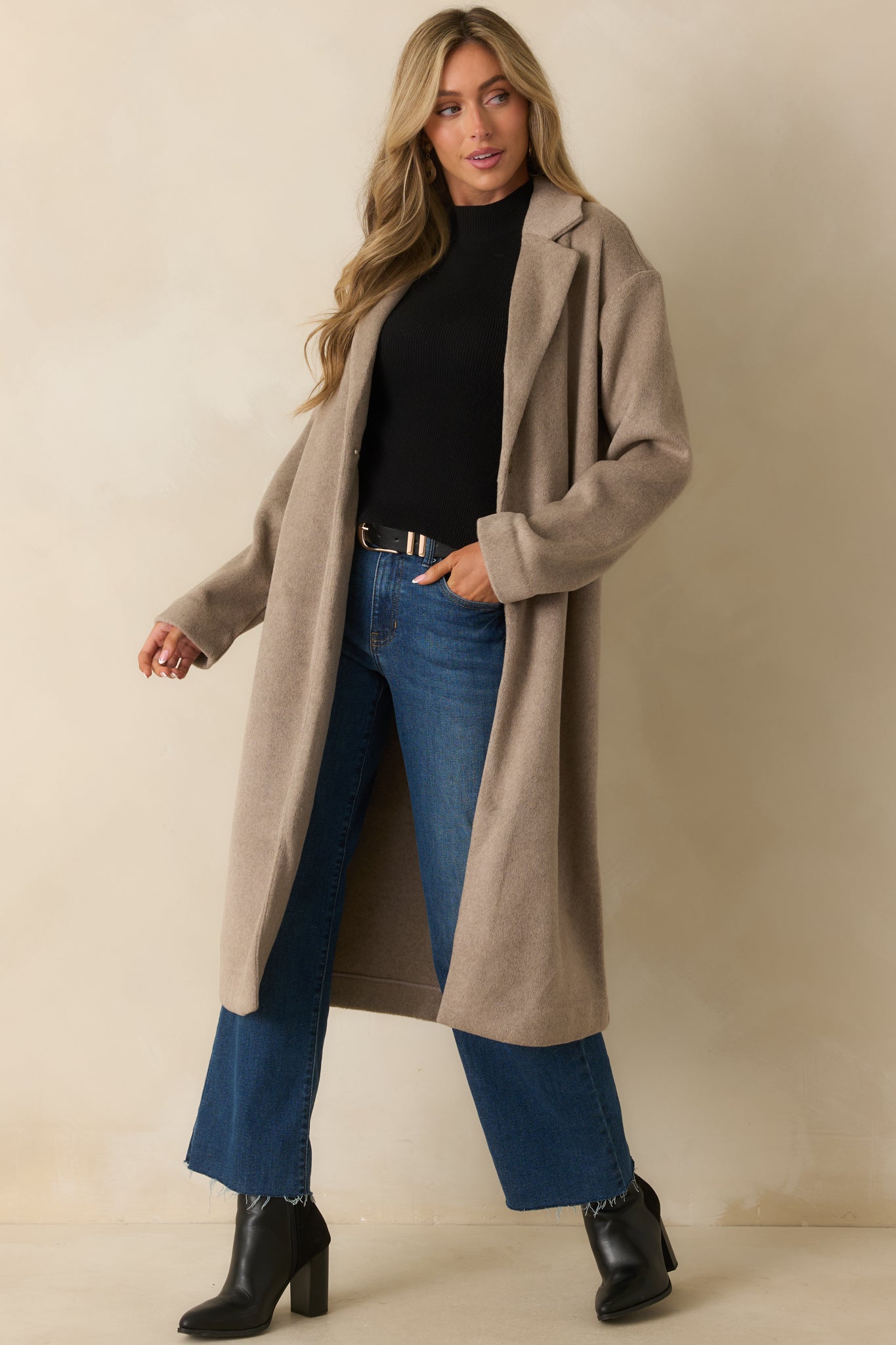 Full body front view of taupe longline coat with collared neckline, notched lapels, and single front button closure.