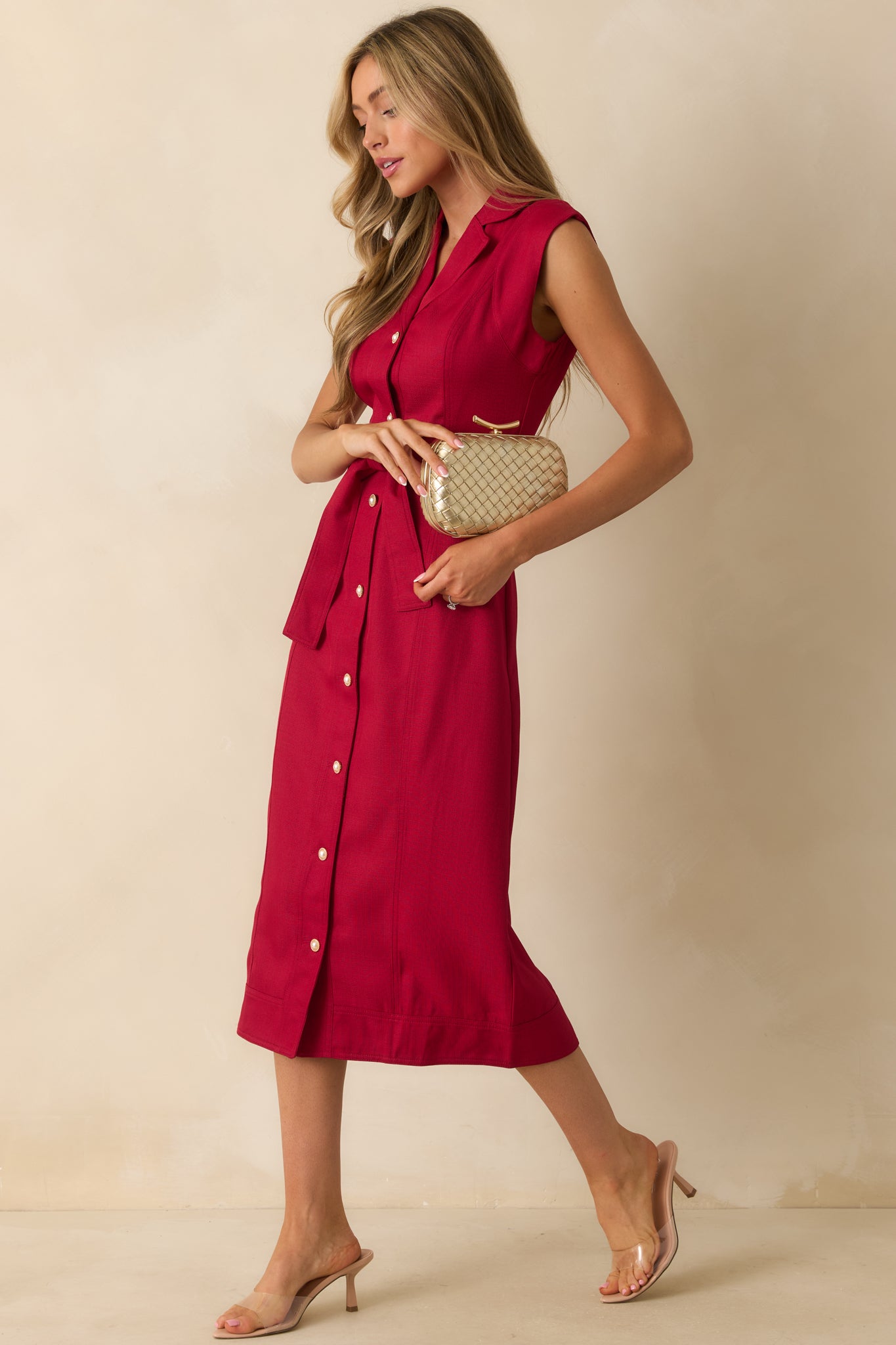 Red wine midi dress showcasing its collared neckline, button front, and cap sleeve design from a slightly angled front view.