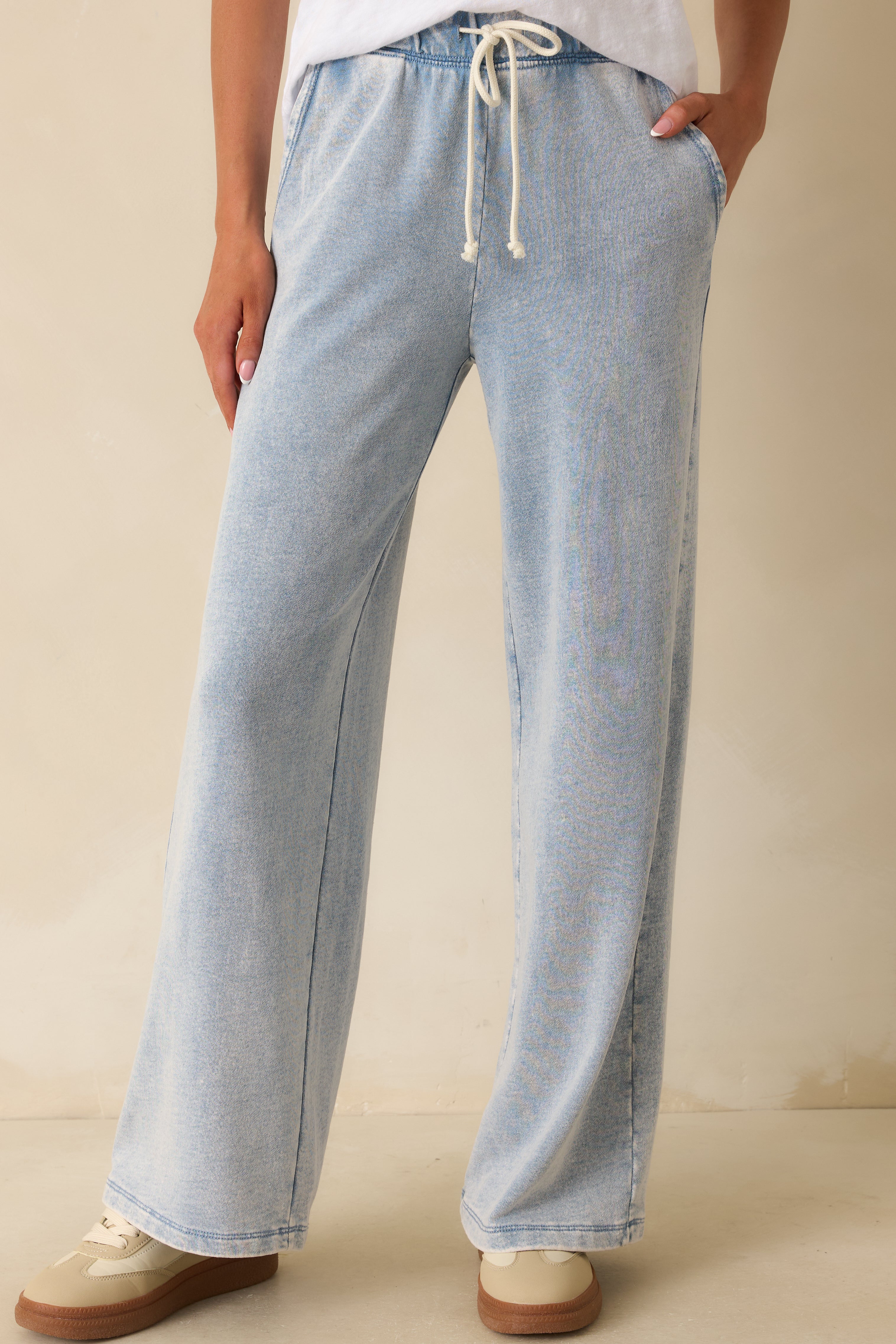 Close view of the waistband and upper fit, emphasizing the drawstring and smooth drape.