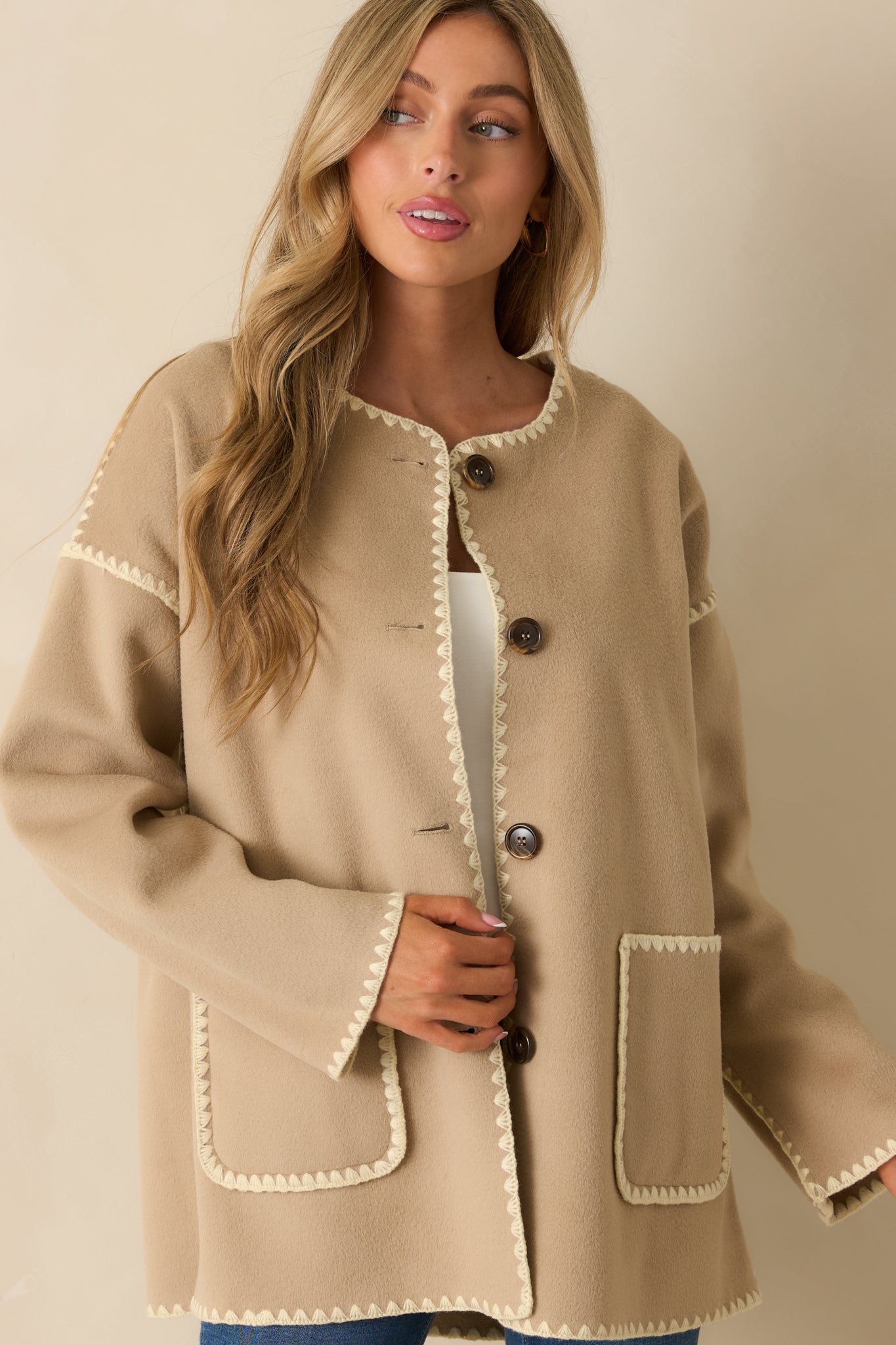 Cropped sleeve detail emphasizing the blanket stitch along the long sleeve.