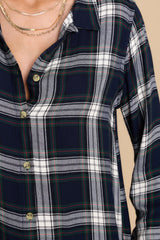 Close up view of the plaid pattern in shades of blue, red, green, and white.