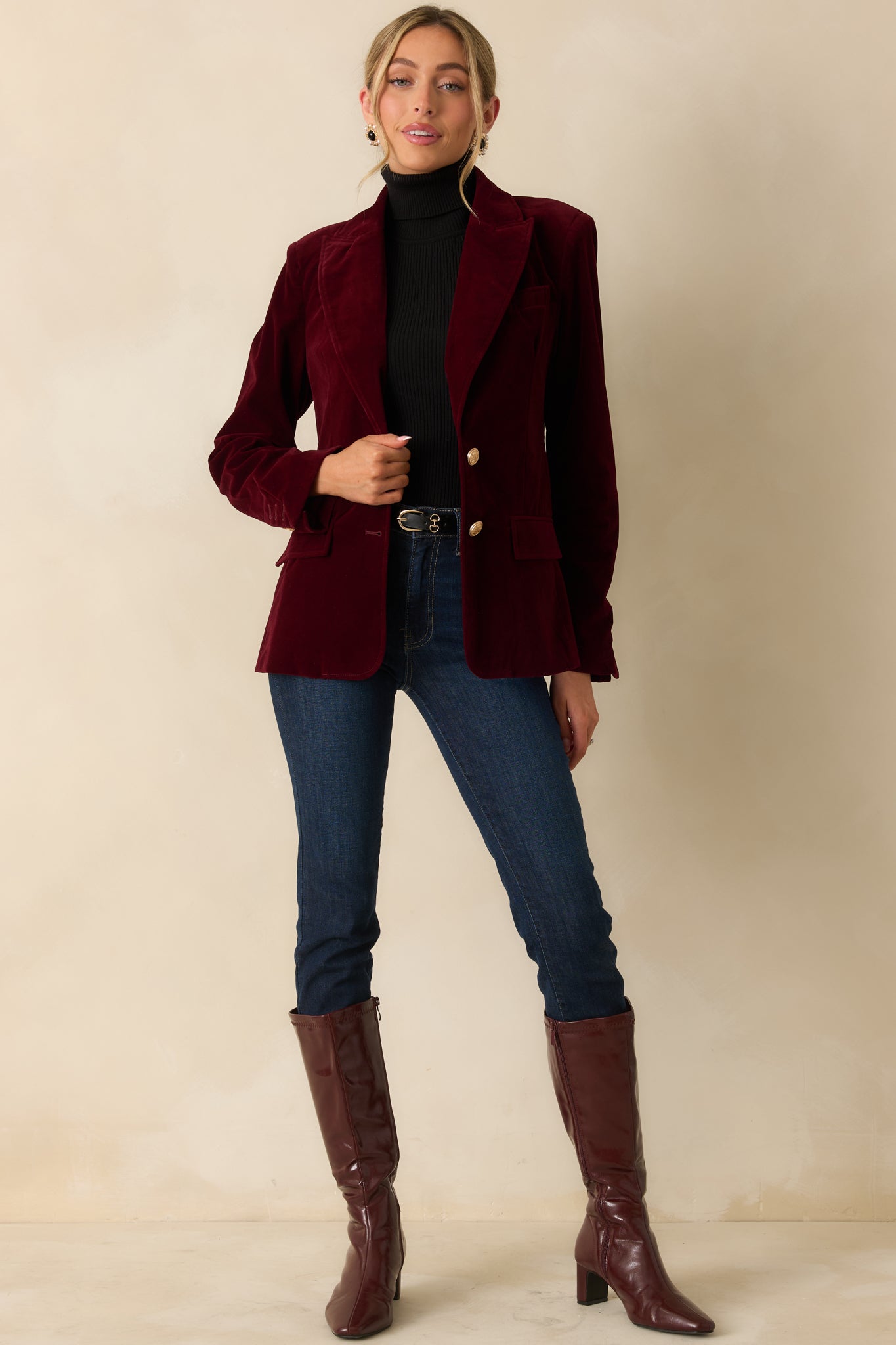 Structured merlot blazer featuring decorative front flap pockets and smooth velvet finish throughout.