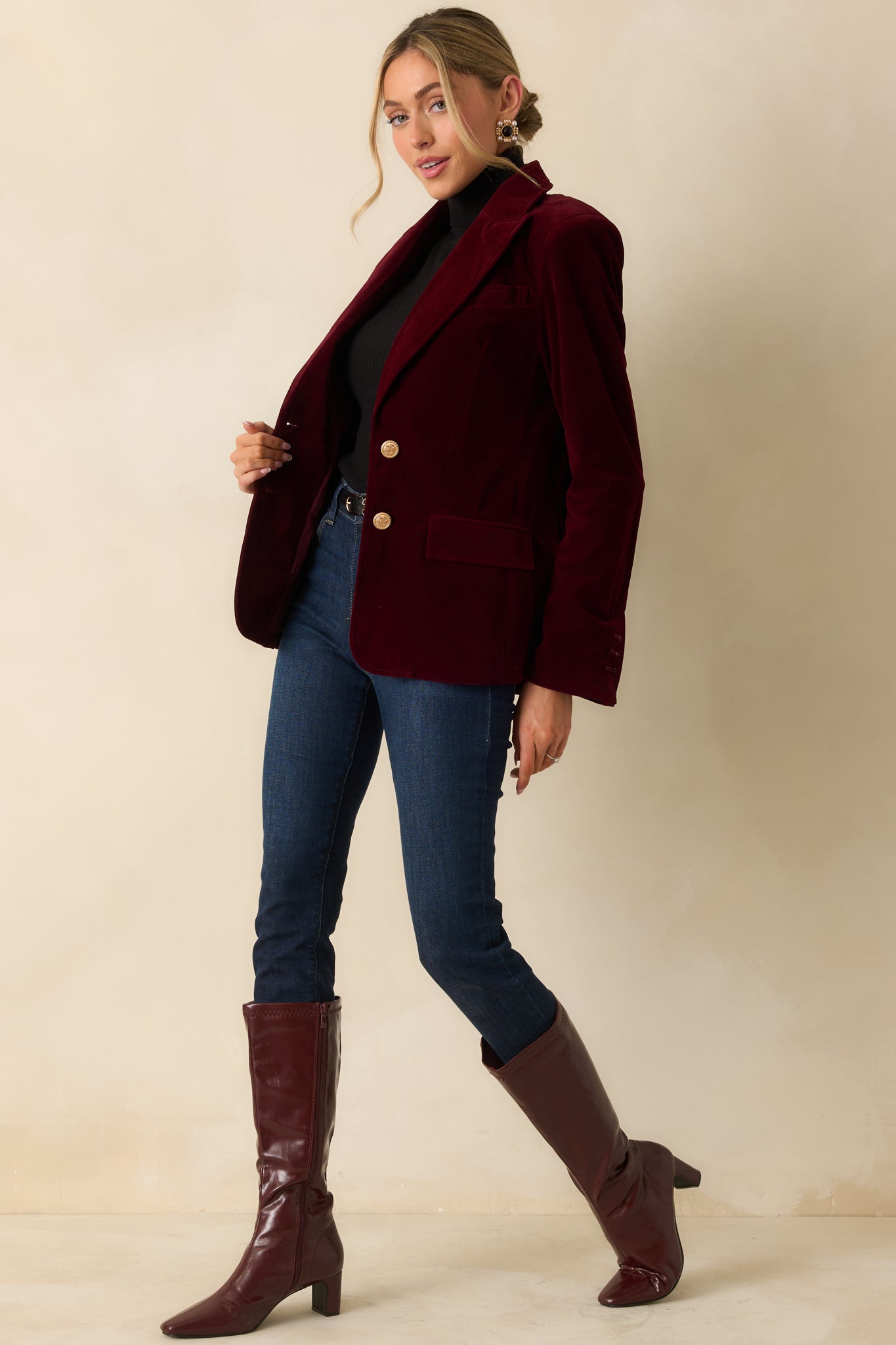 Merlot velvet blazer with a notched lapel collar, long ruched sleeves, and a structured two-button front closure.