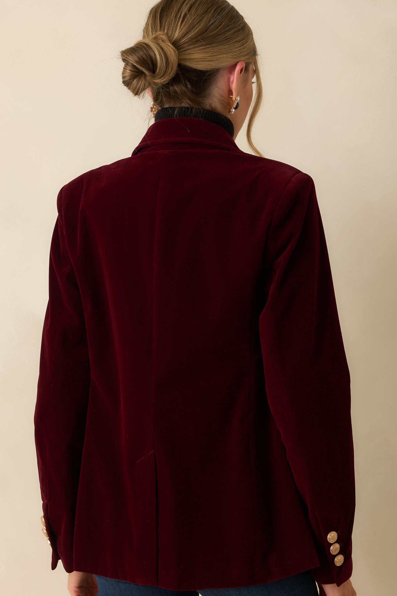 Rear view of the merlot velvet blazer showing the smooth, structured fit and clean back seam.