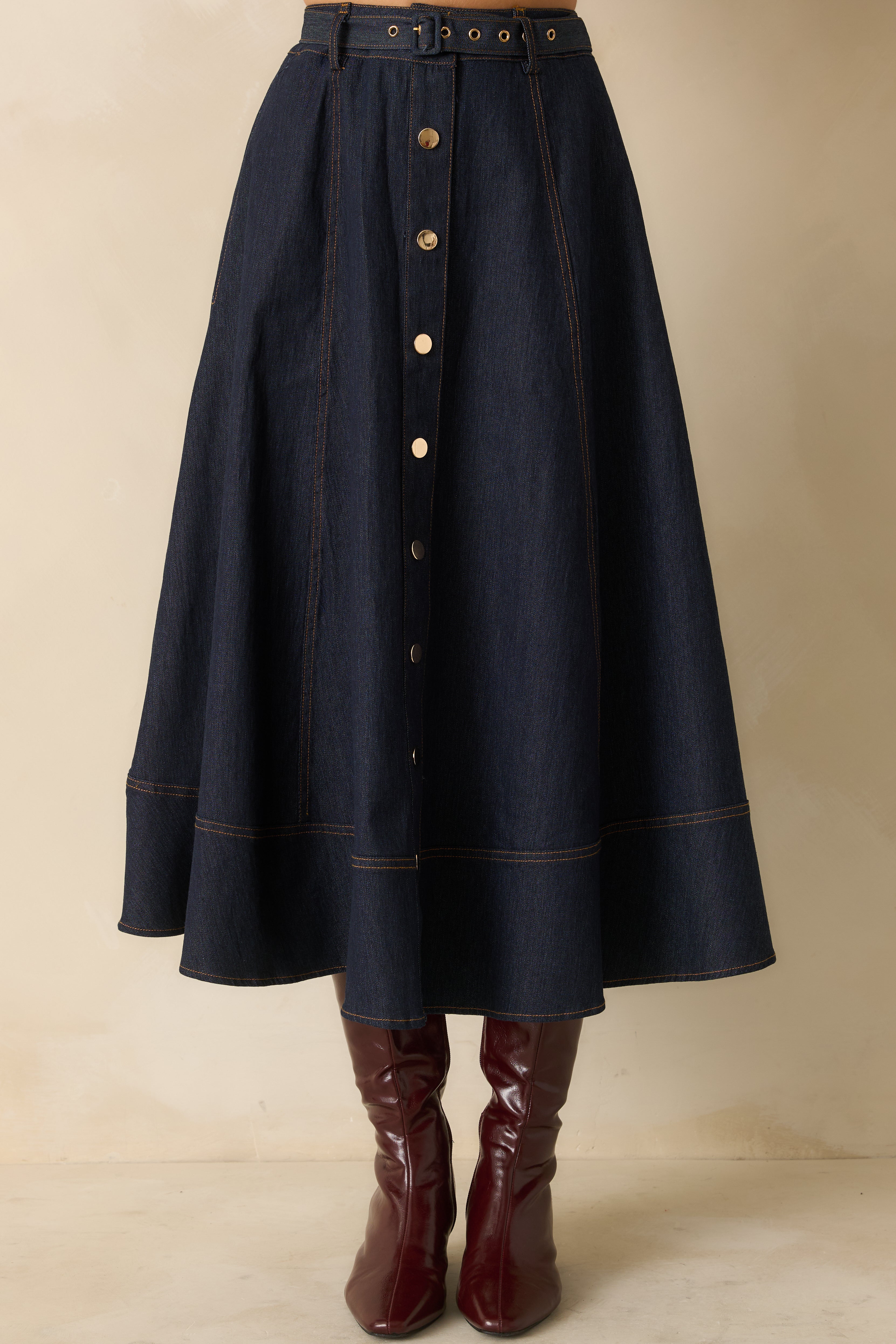 Cropped waist view focusing on the snap button closure and belt detail.