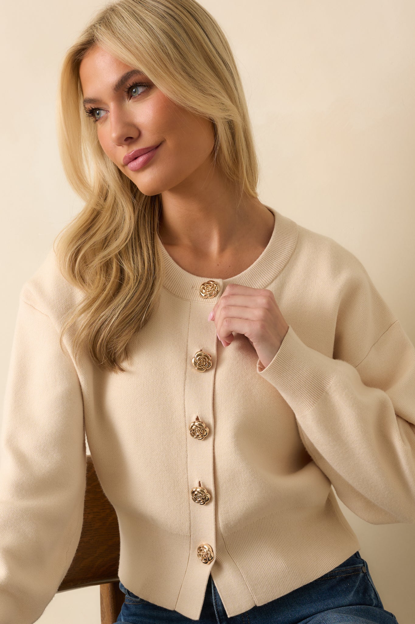 Cropped close view emphasizing the fitted waistband and long sleeve detailing.