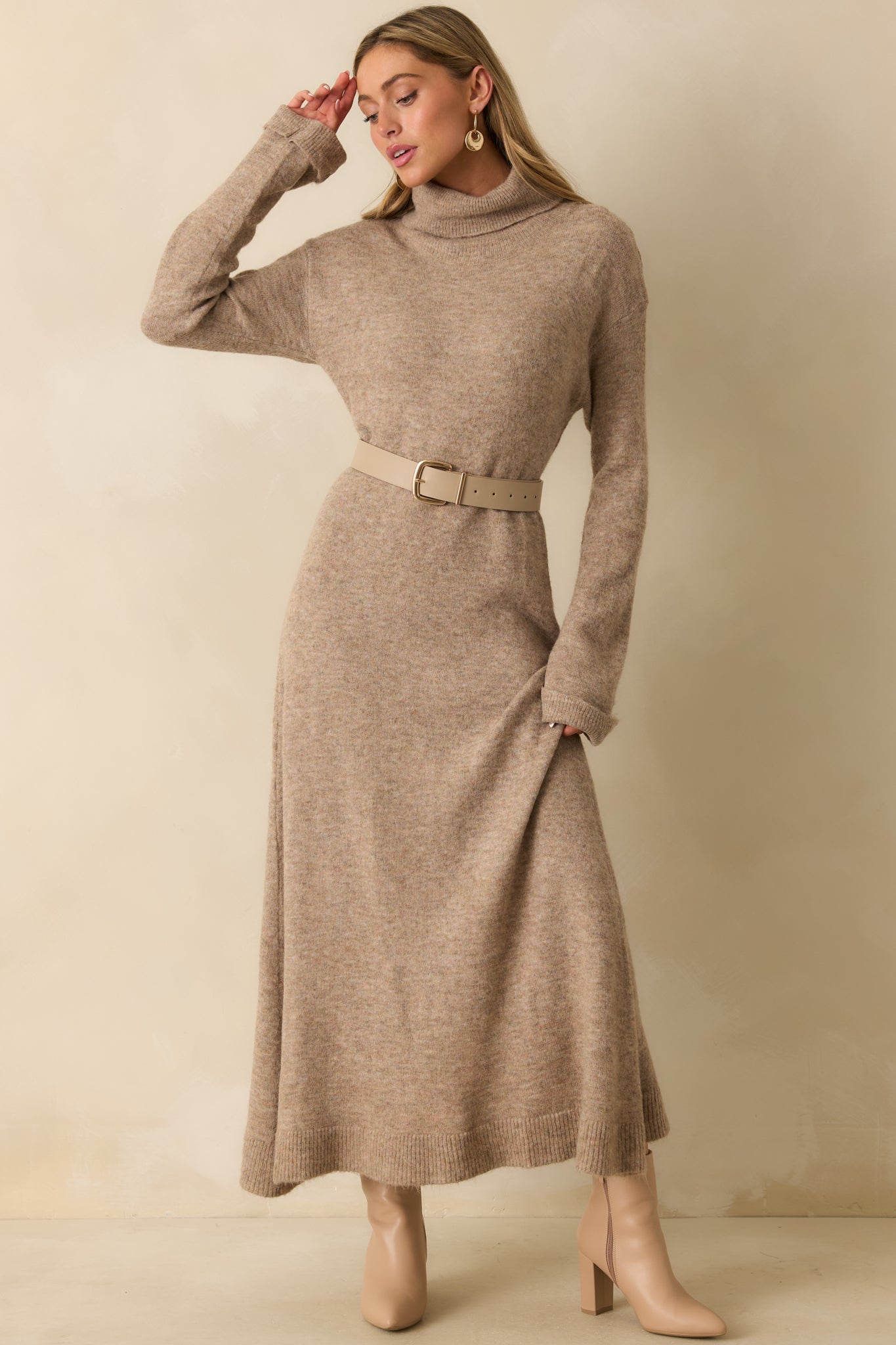 Beige maxi dress highlighting the relaxed silhouette and smooth fall of the brushed knit fabric.