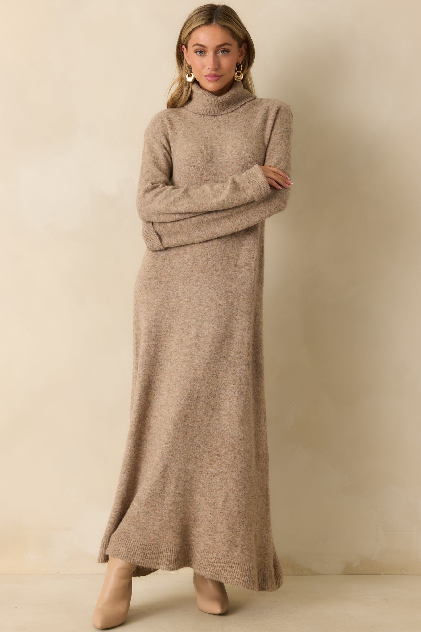 Beige knit maxi dress showcasing the maxi length and casual, comfortable sweater-like fabric.
