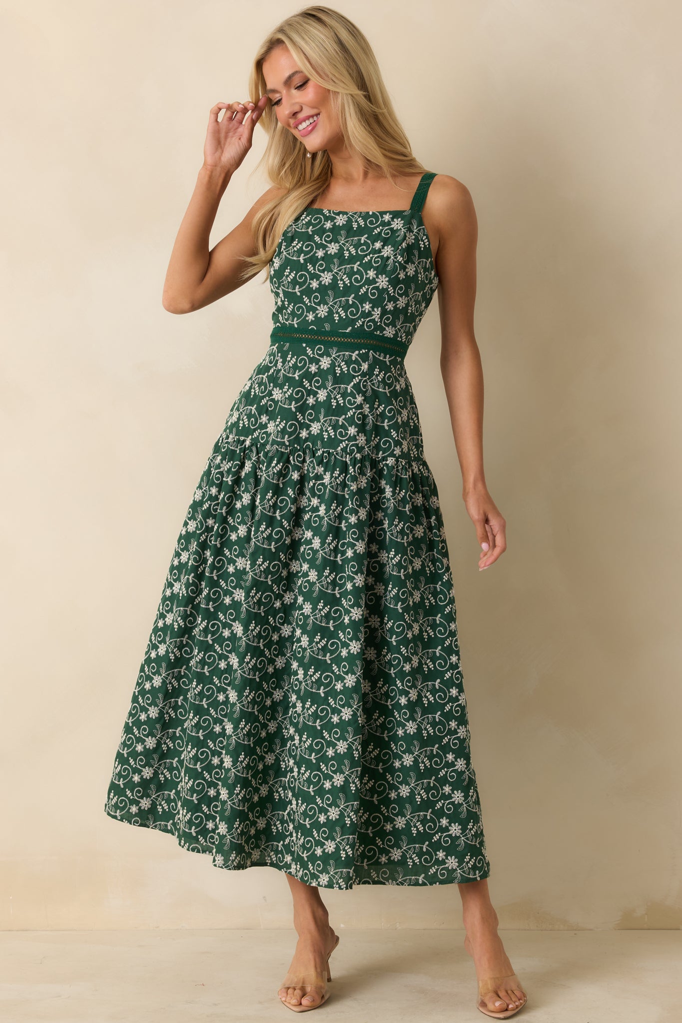 Hunter green maxi dress with smooth fabric, square neckline, and adjustable straps, highlighting relaxed drop waist design.
