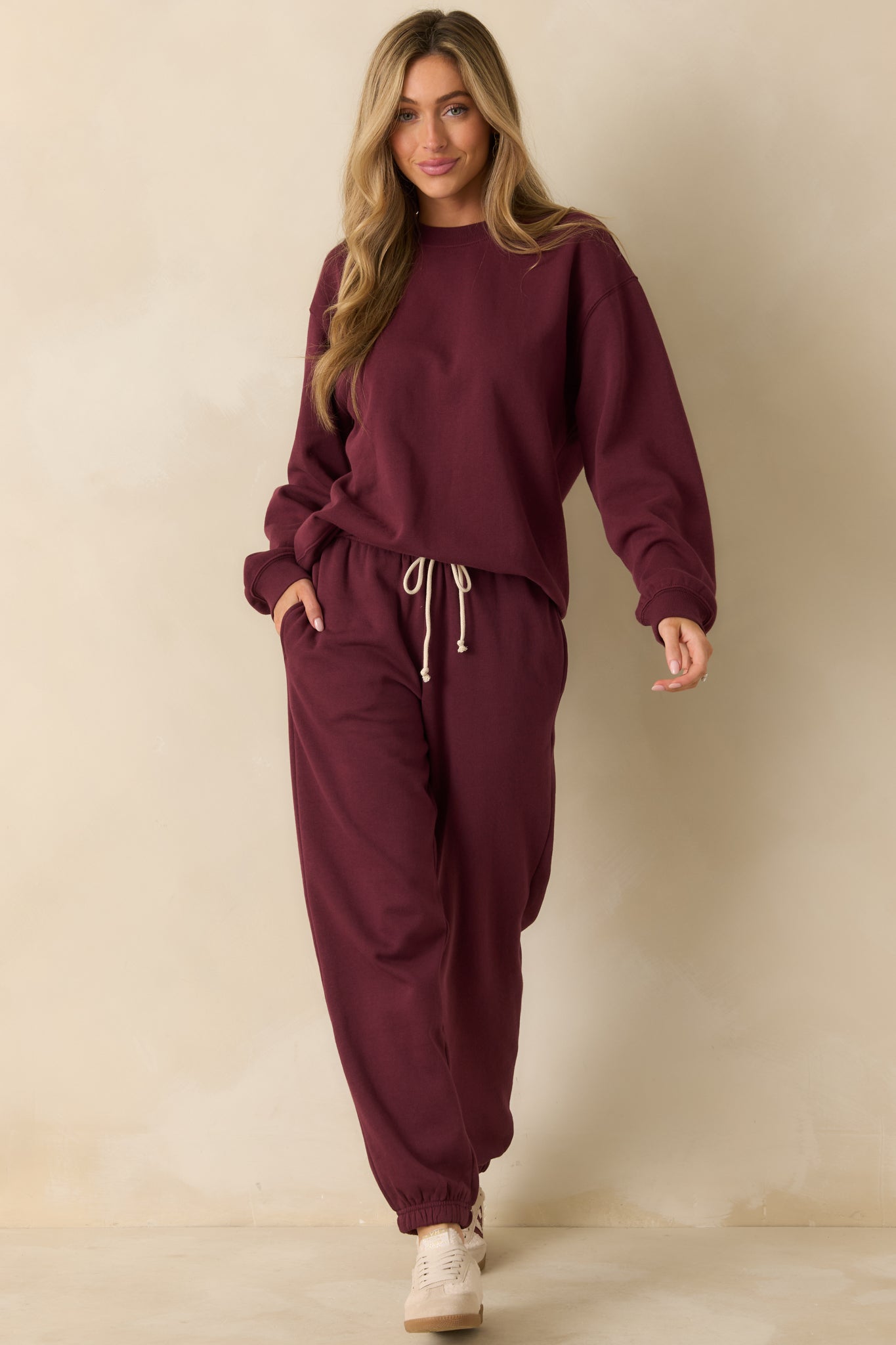 Cozy merlot sweatshirt featuring a relaxed silhouette and smooth fleece finish.
