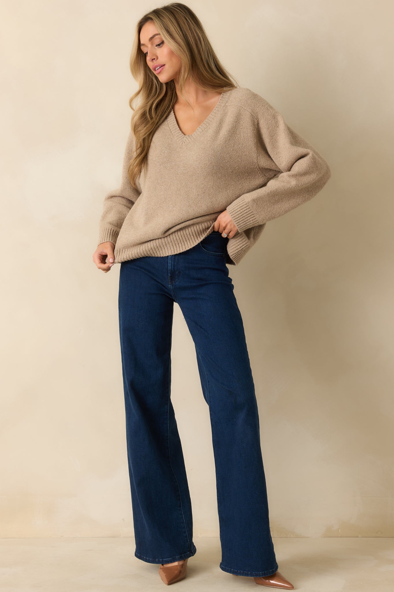 Relaxed-fit V-neck sweater showcasing soft knit construction and comfortable layering design.