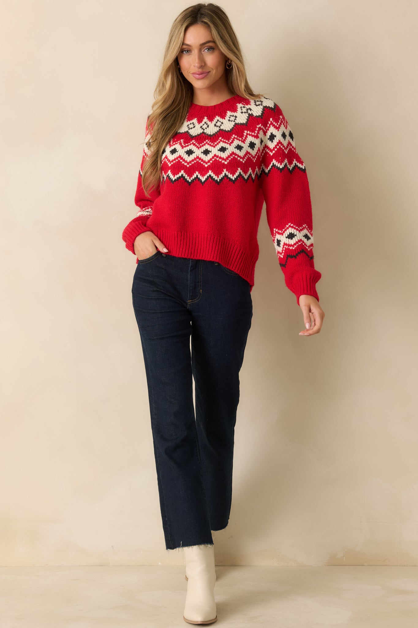 Relaxed-fit red sweater with long sleeves and allover fair isle-inspired pattern for a holiday-ready look.
