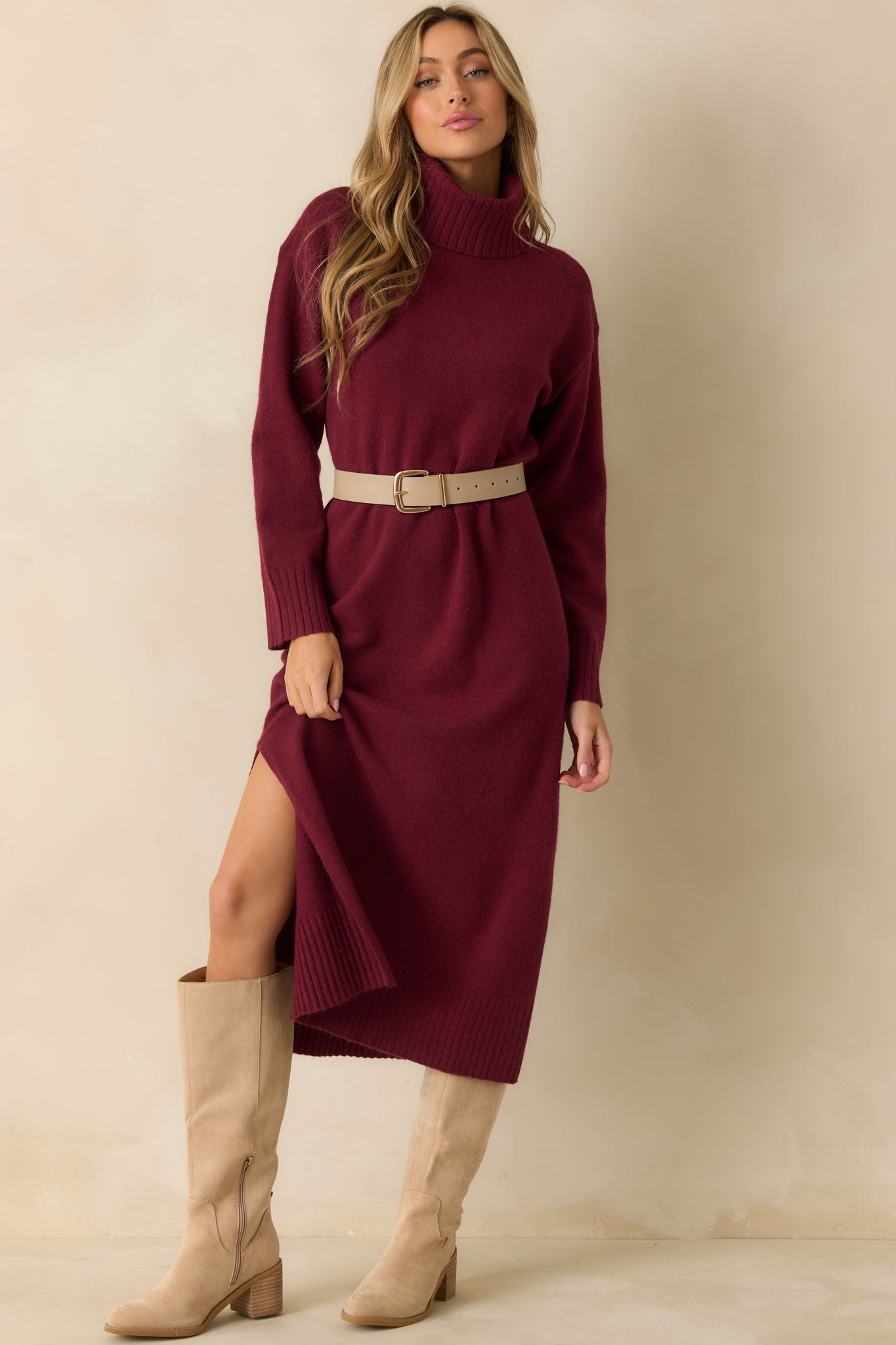 Midi-length burgundy knit dress showcasing the smooth, stretchy fabric and classic turtleneck style.