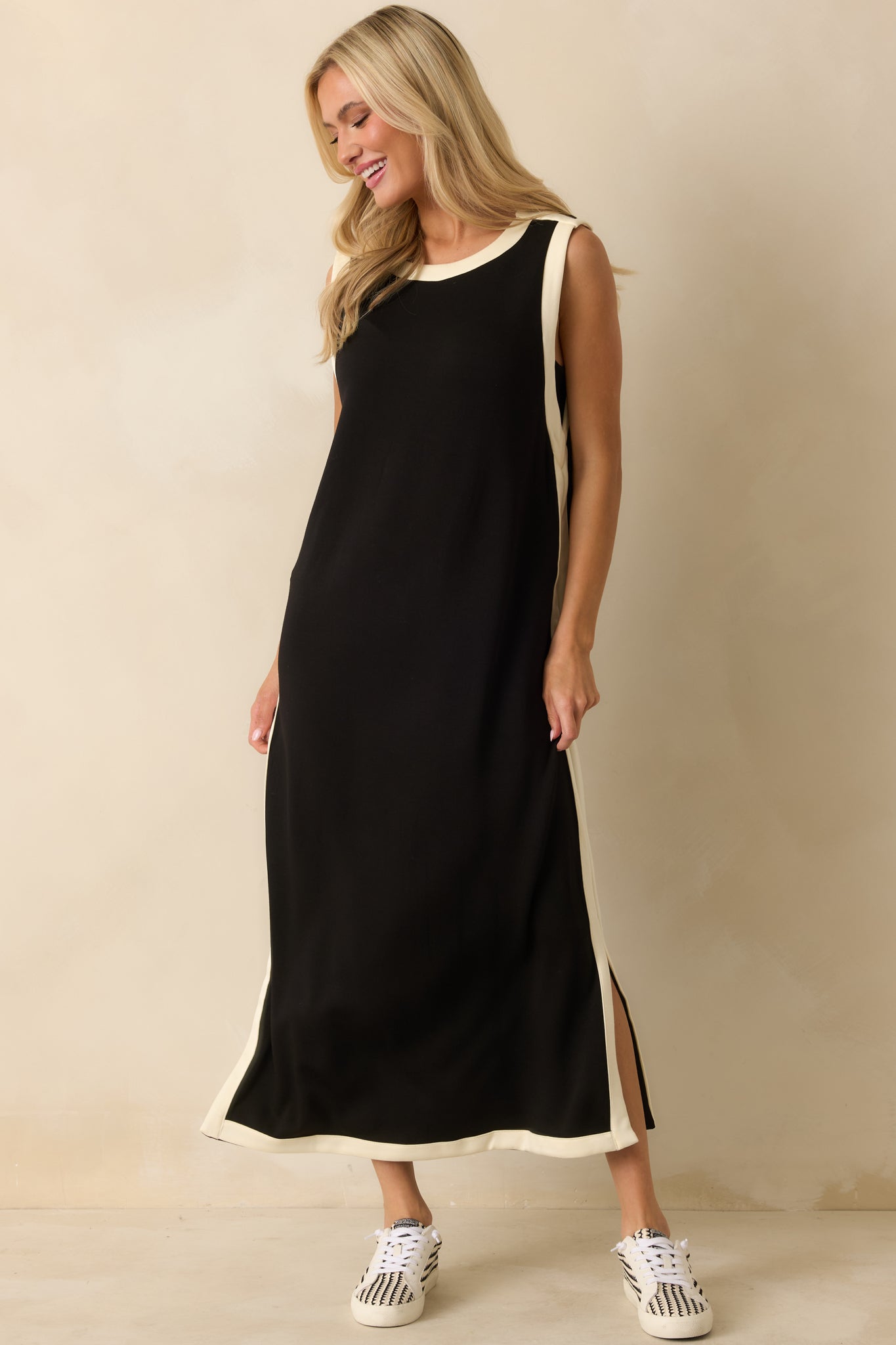 Maxi dress highlighting contrast ivory trim along the neckline, armholes, and side seams.
