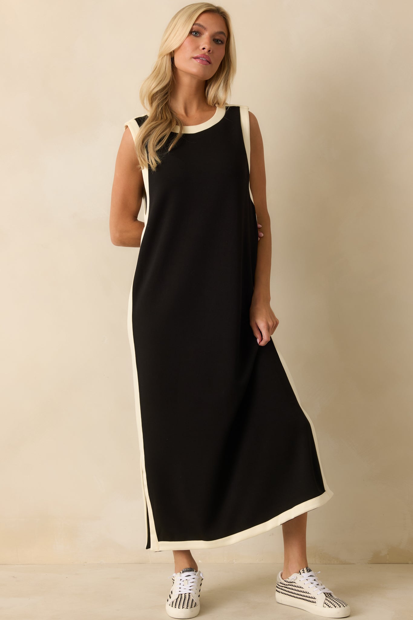 Front view of the relaxed straight silhouette and clean hem with ivory edging.