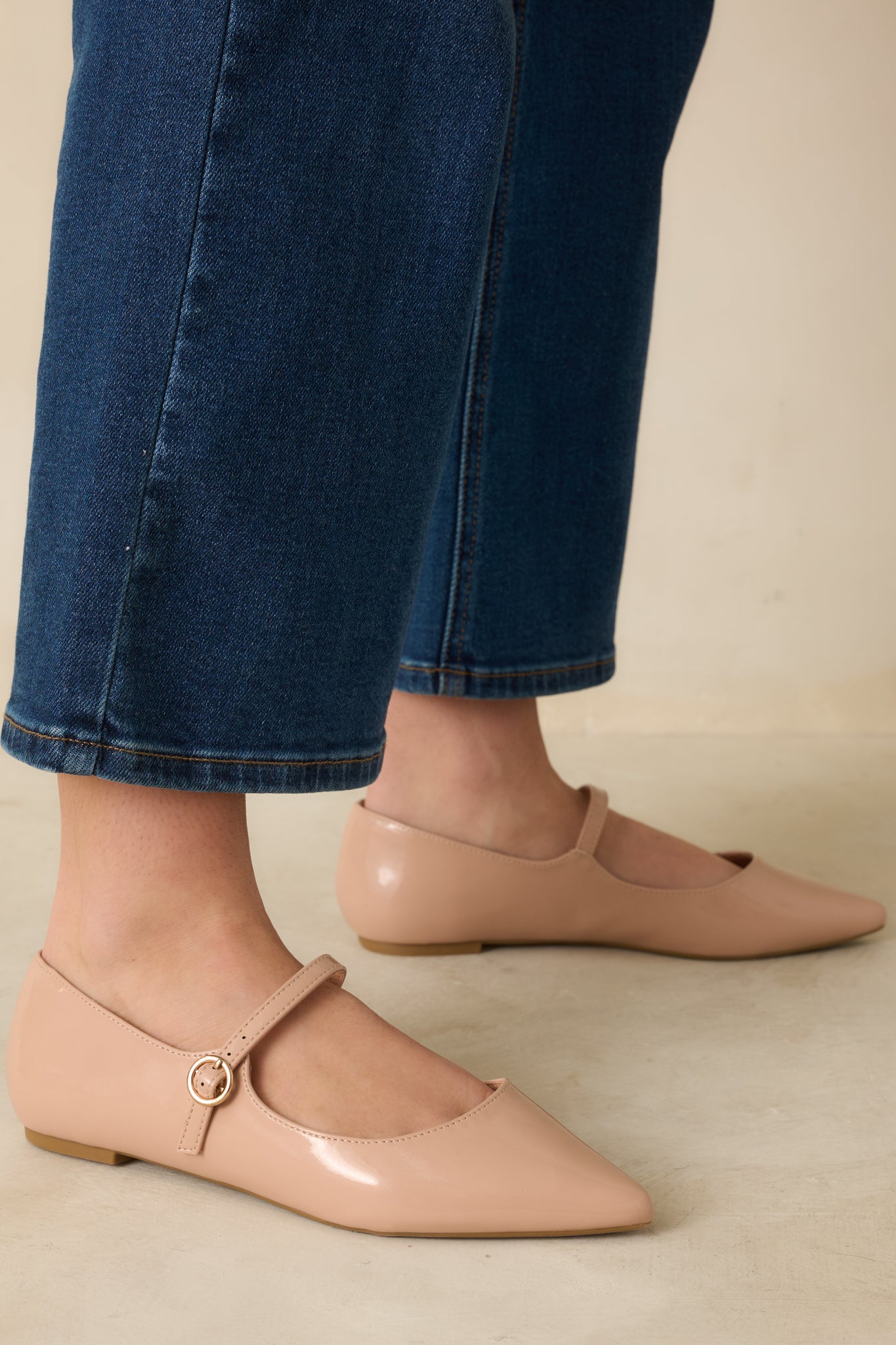 Side view of the ballet pink nude flats highlighting the cushioned sole and sleek silhouette.