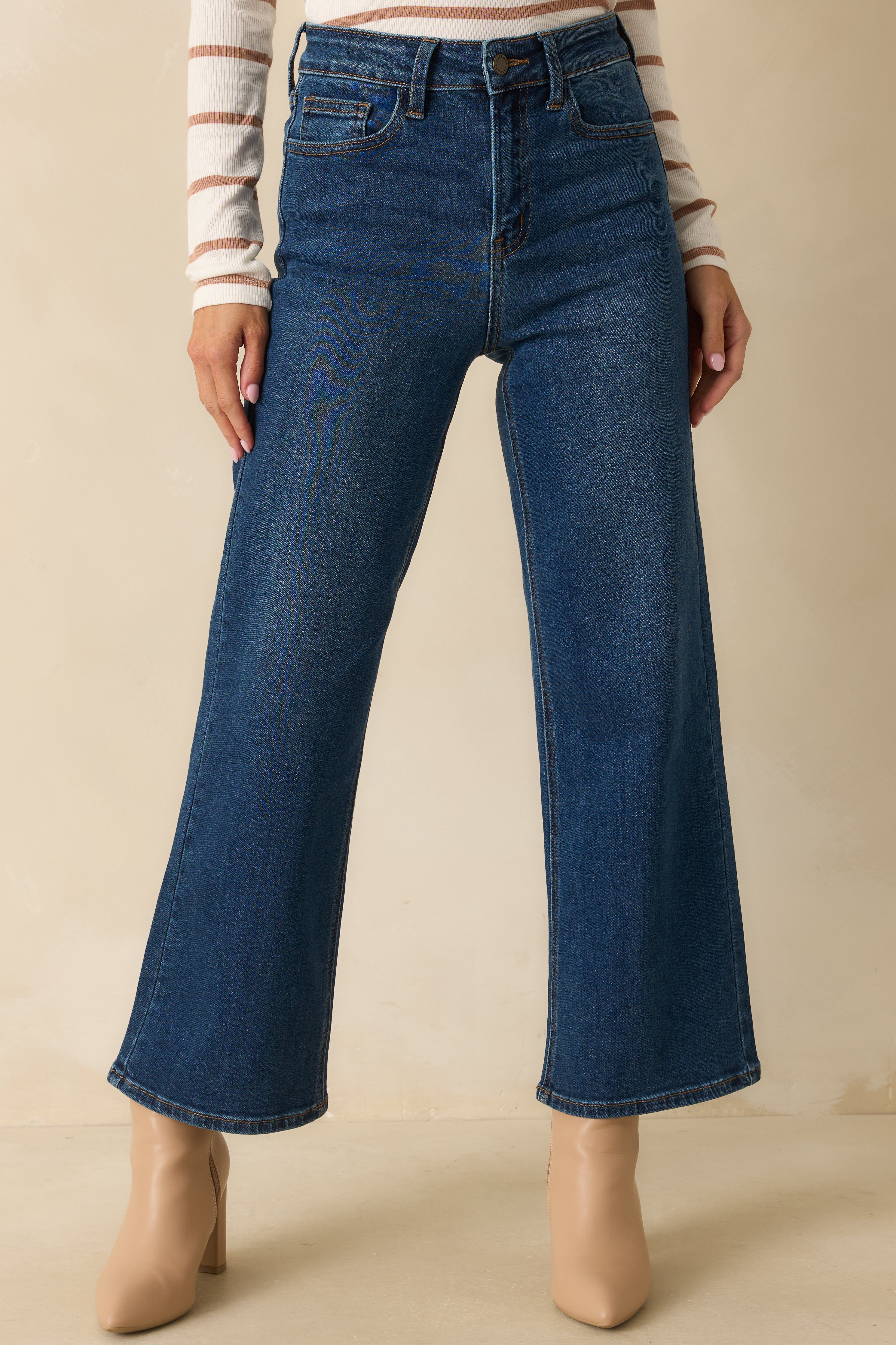 Front section focusing on the smooth dark denim and functional front pockets.