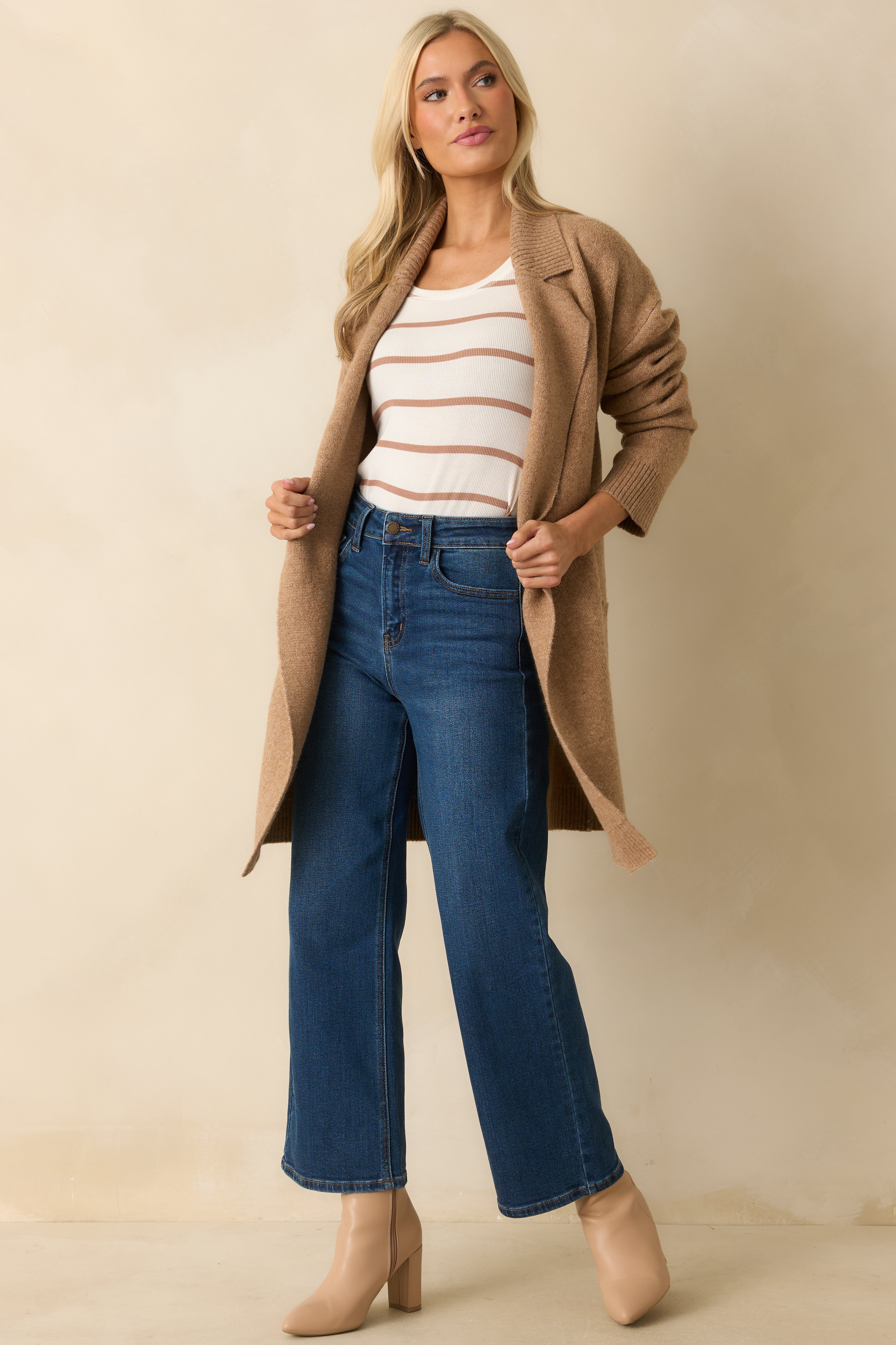 Front view of the long-sleeve camel cardigan highlighting its drop shoulders and ribbed hem.