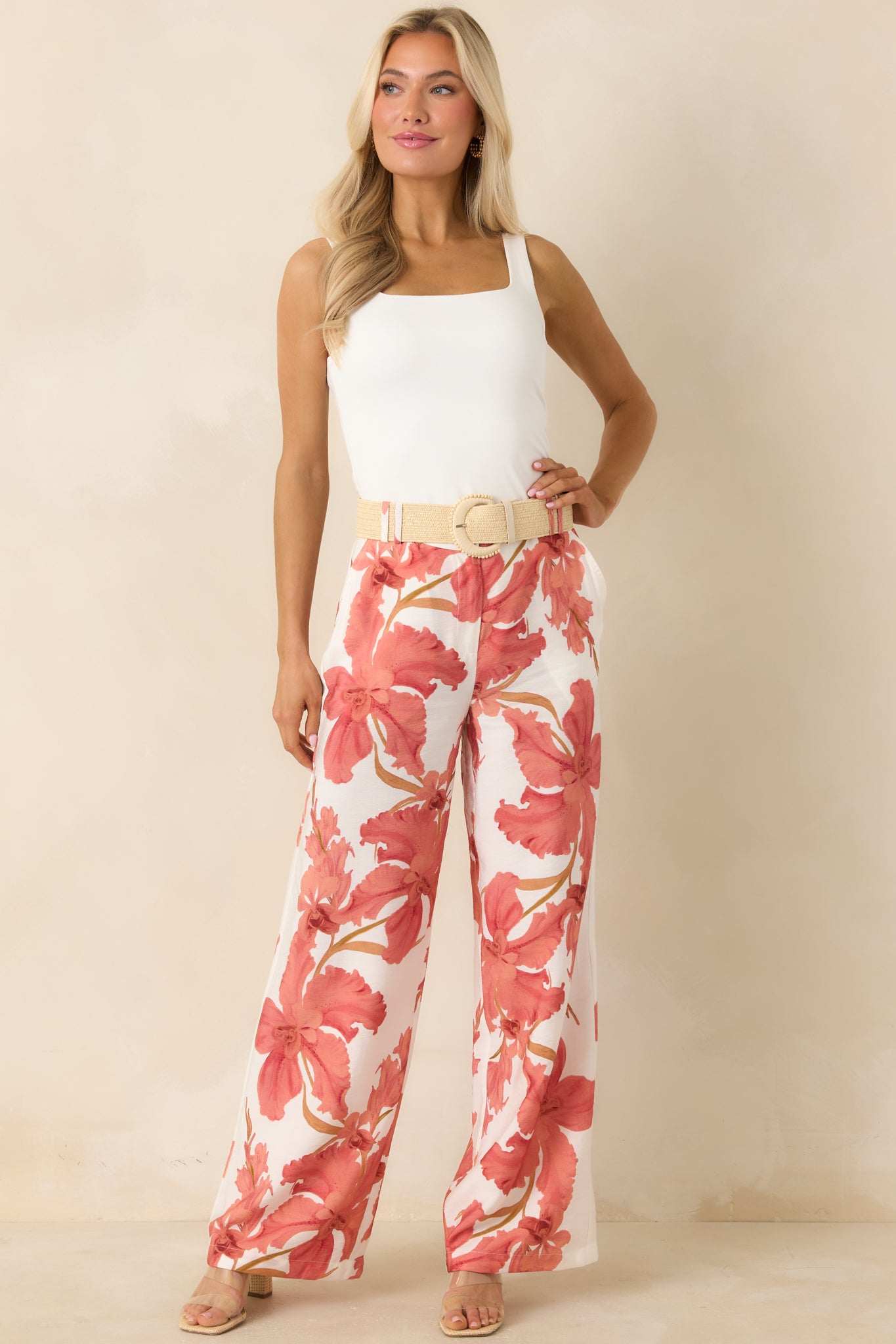 MINKPINK peach hibiscus wide leg pants featuring a flowing silhouette and soft, feminine floral print.