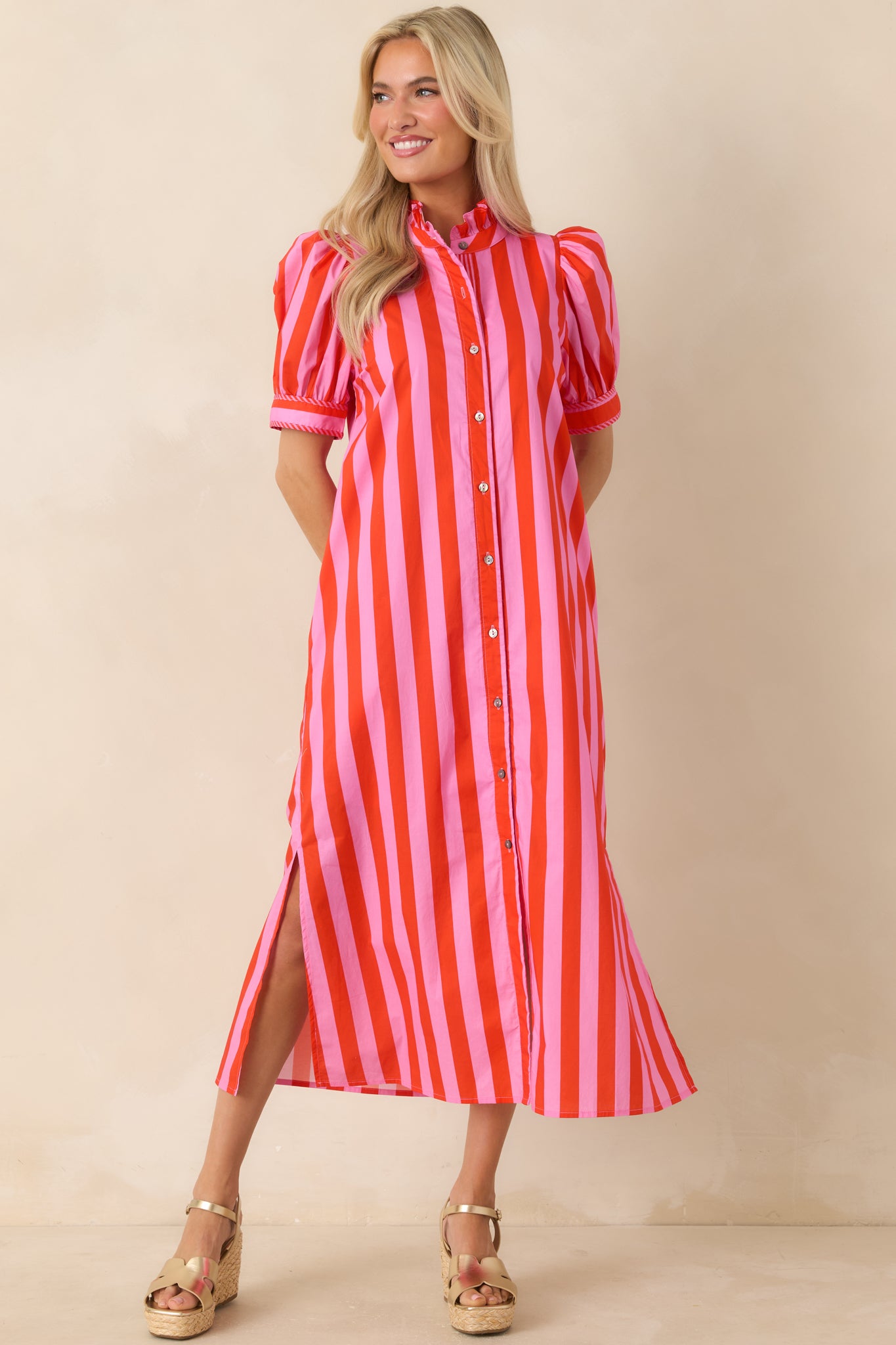Cotton midi dress with vertical stripes, front button closure, and airy summer-ready construction.