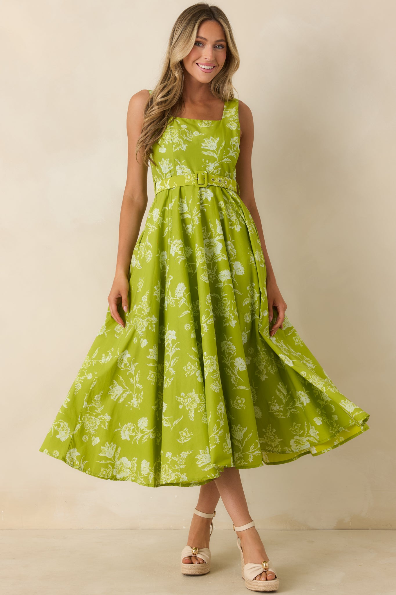 Floral cotton midi dress with a structured silhouette, vibrant chartreuse print, side pockets, and a flattering belted waist.