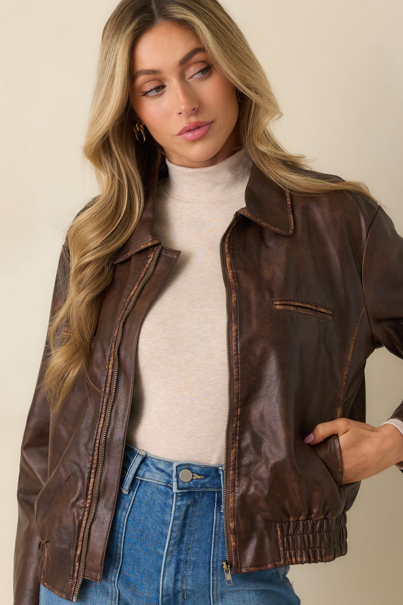 View highlighting the welt chest pocket and smooth front zip closure.