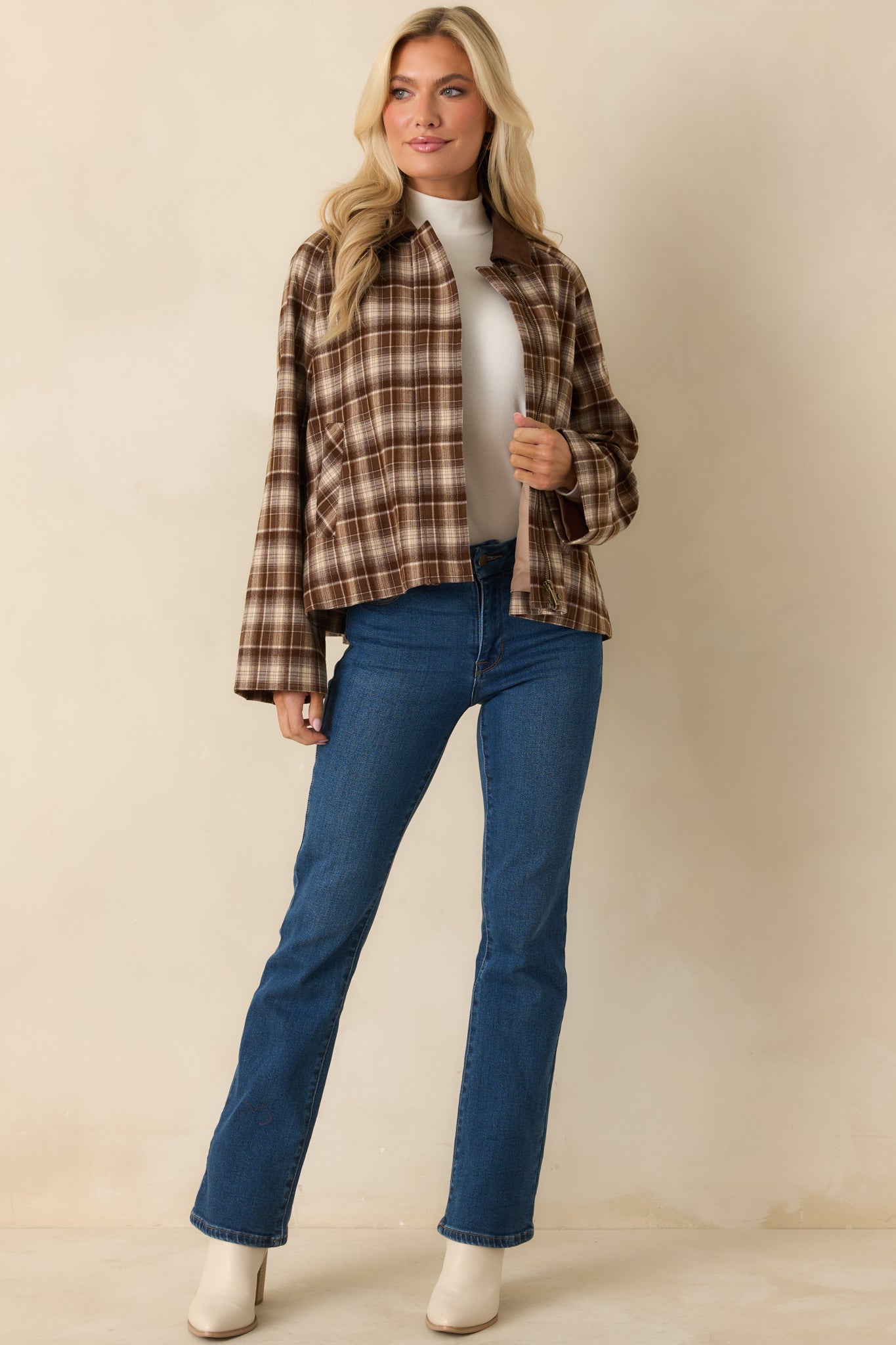 Plaid jacket highlighting the zip-front closure and corduroy contrast collar.