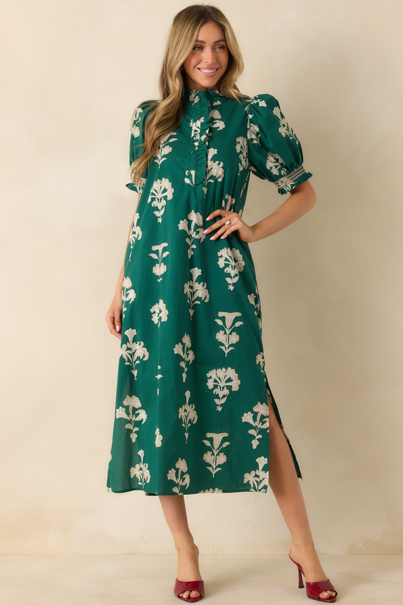 Full view showcasing the short puff sleeves with smocked cuffs and the quarter button front placket with ruffle trim.