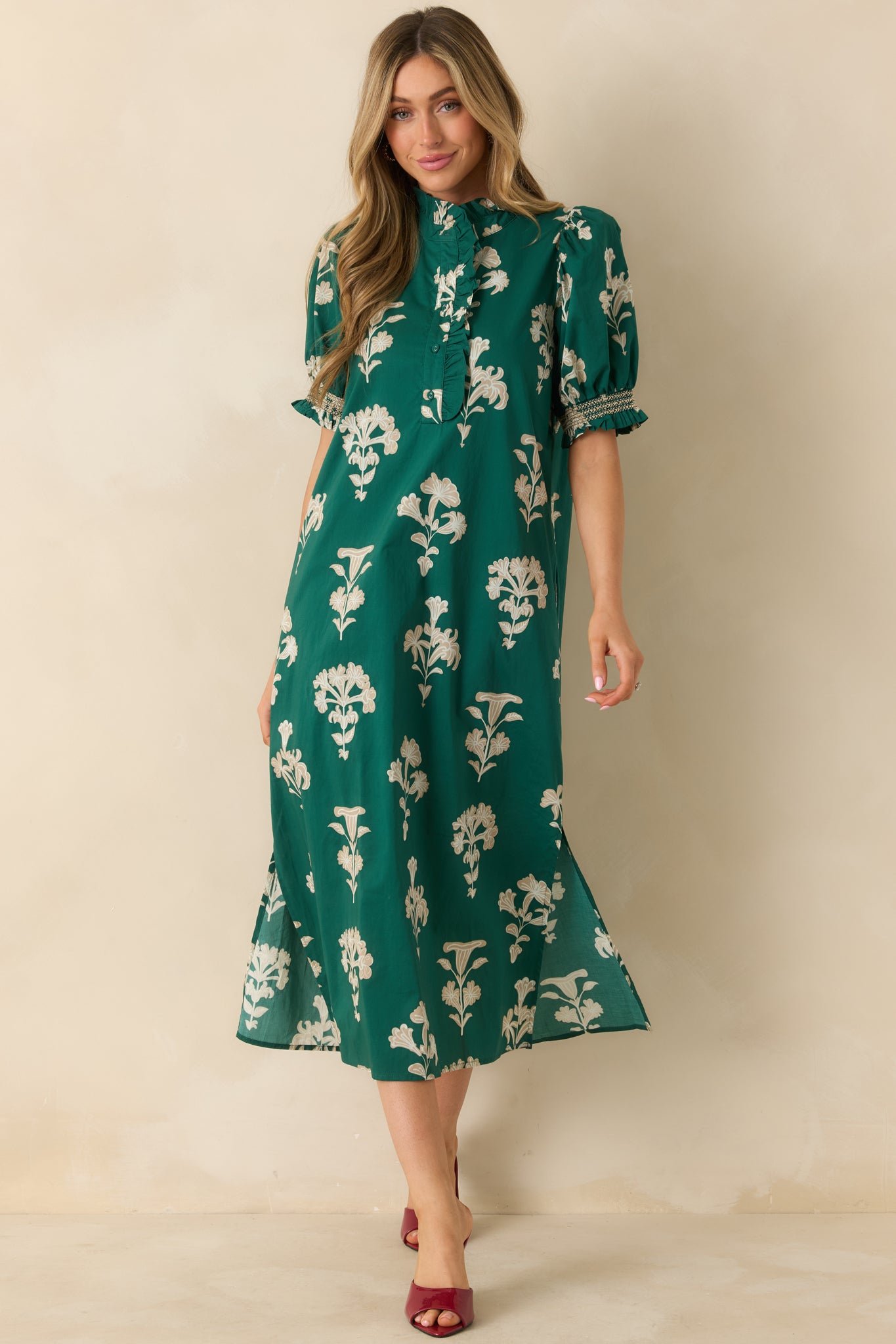 Front-facing angle focusing on the structure and detailing of the neckline, sleeves, and button front design.