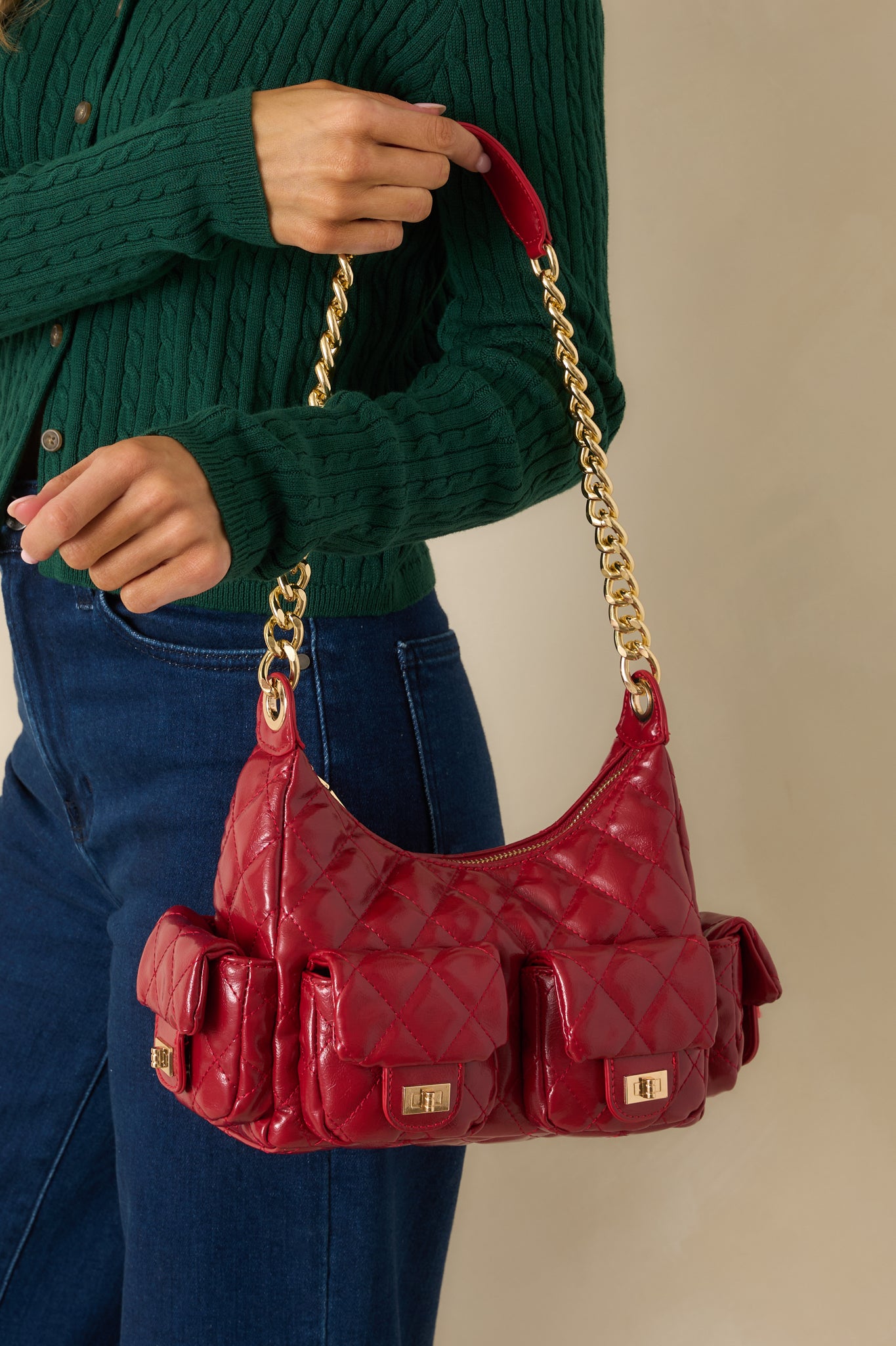 Cropped view emphasizing the quilted texture and rich red faux leather finish