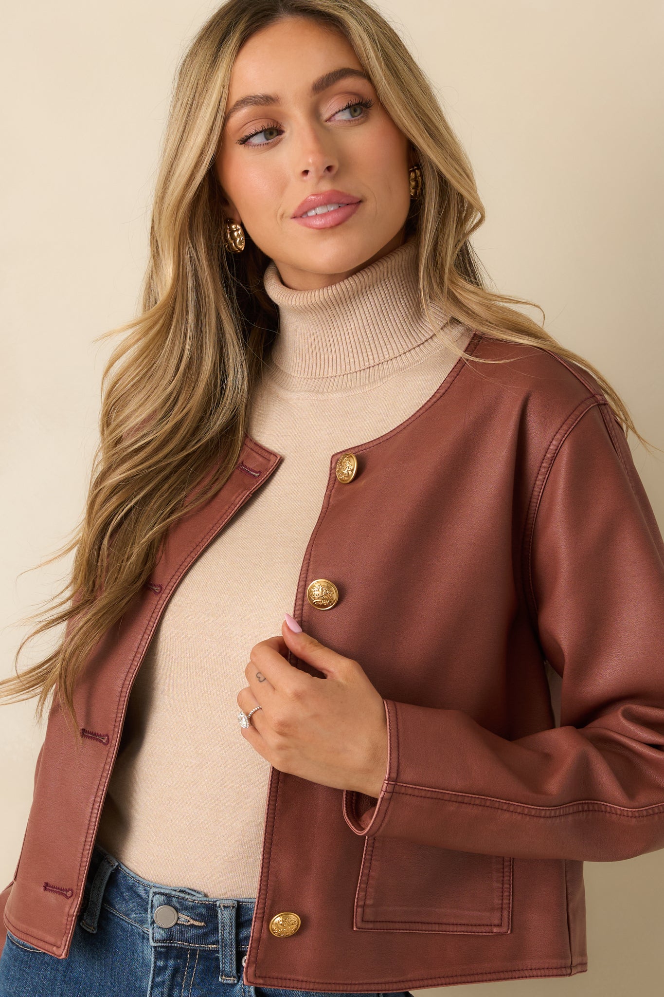 Close look at the round neckline and structured seam details.