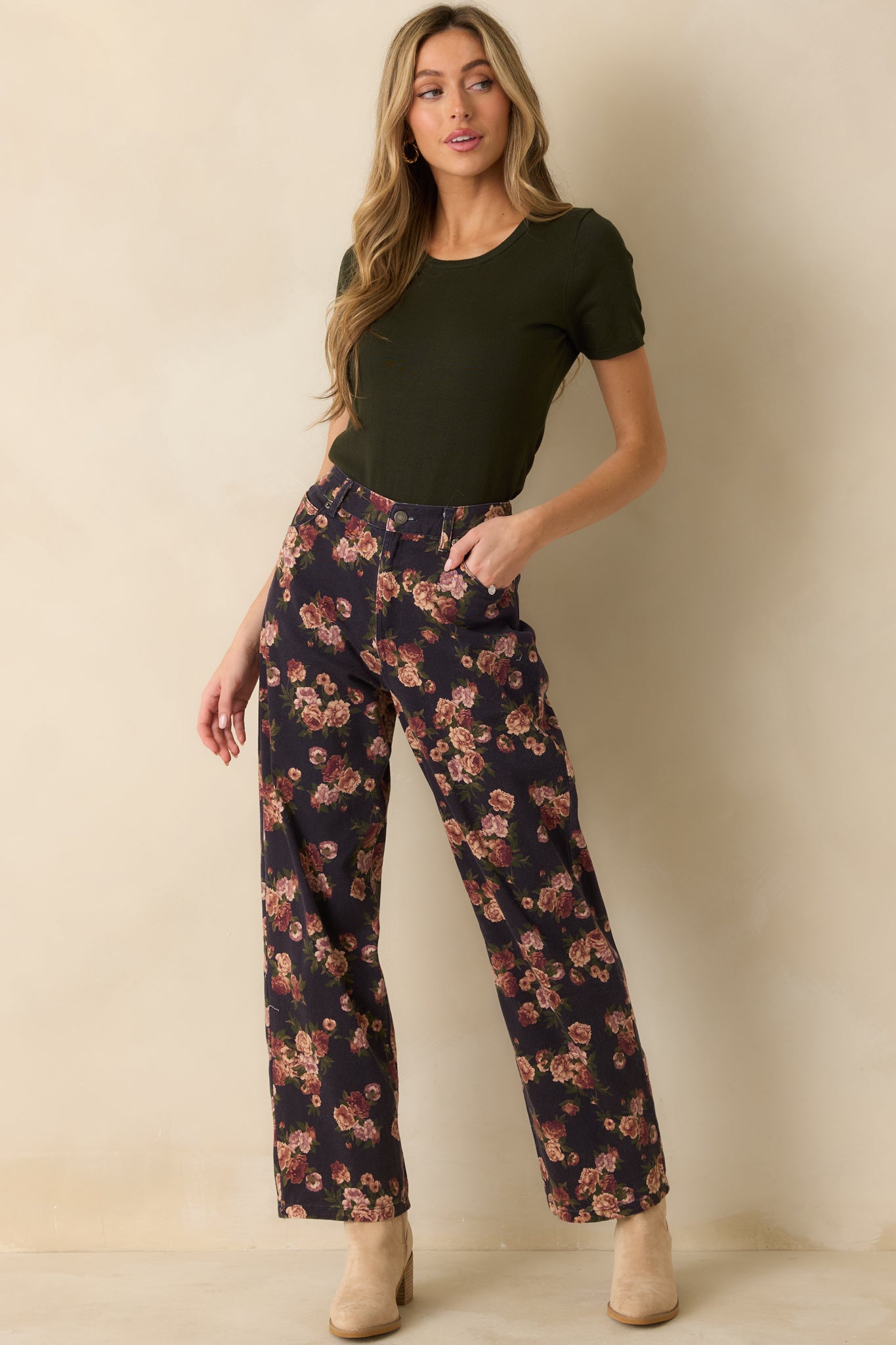 Minimalist dark green top with ribbed trim at the hem and sleeves for a polished everyday style.